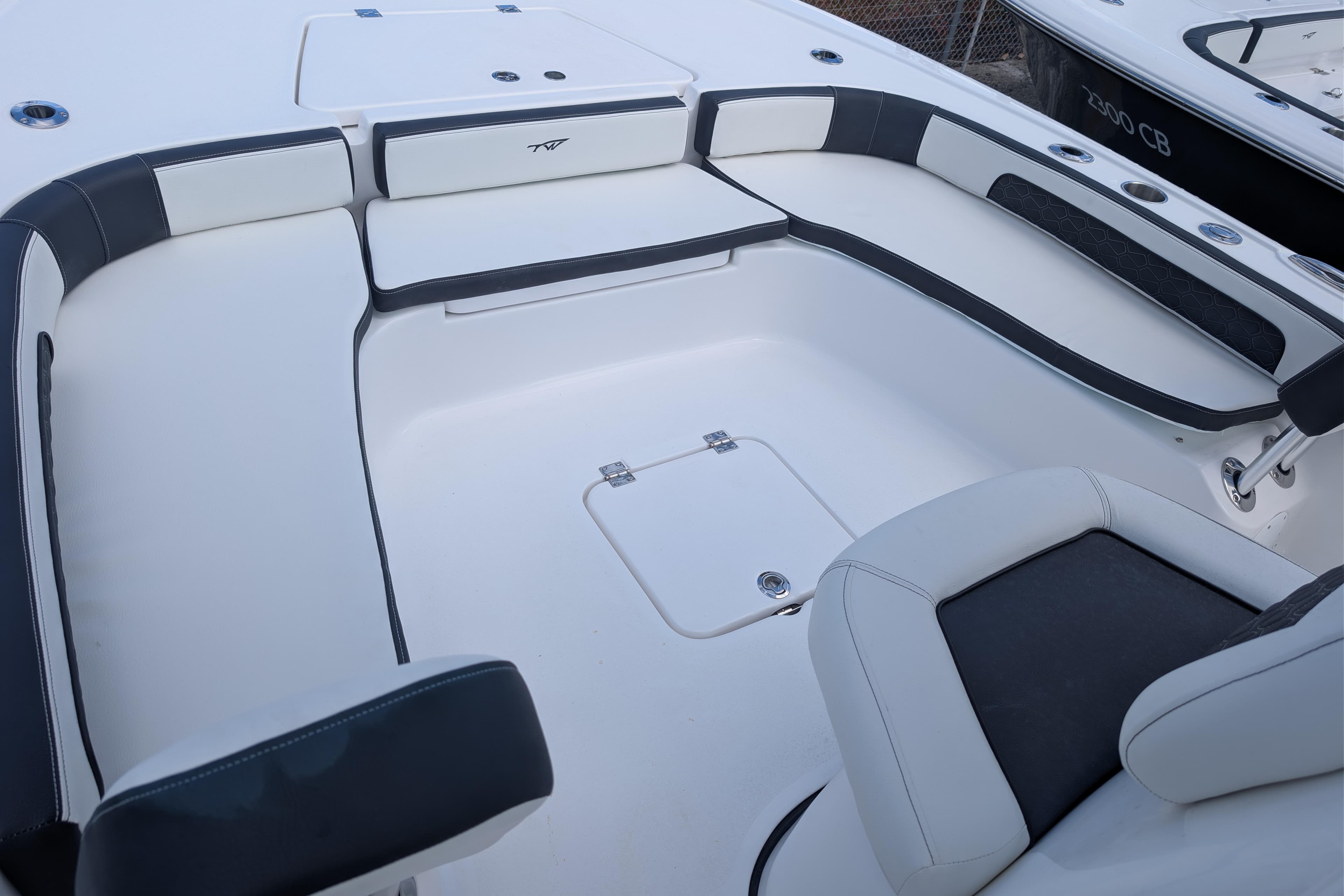 2026 Tidewater 2300 Carolina Bay boat interior with cushioned seating and storage compartments.