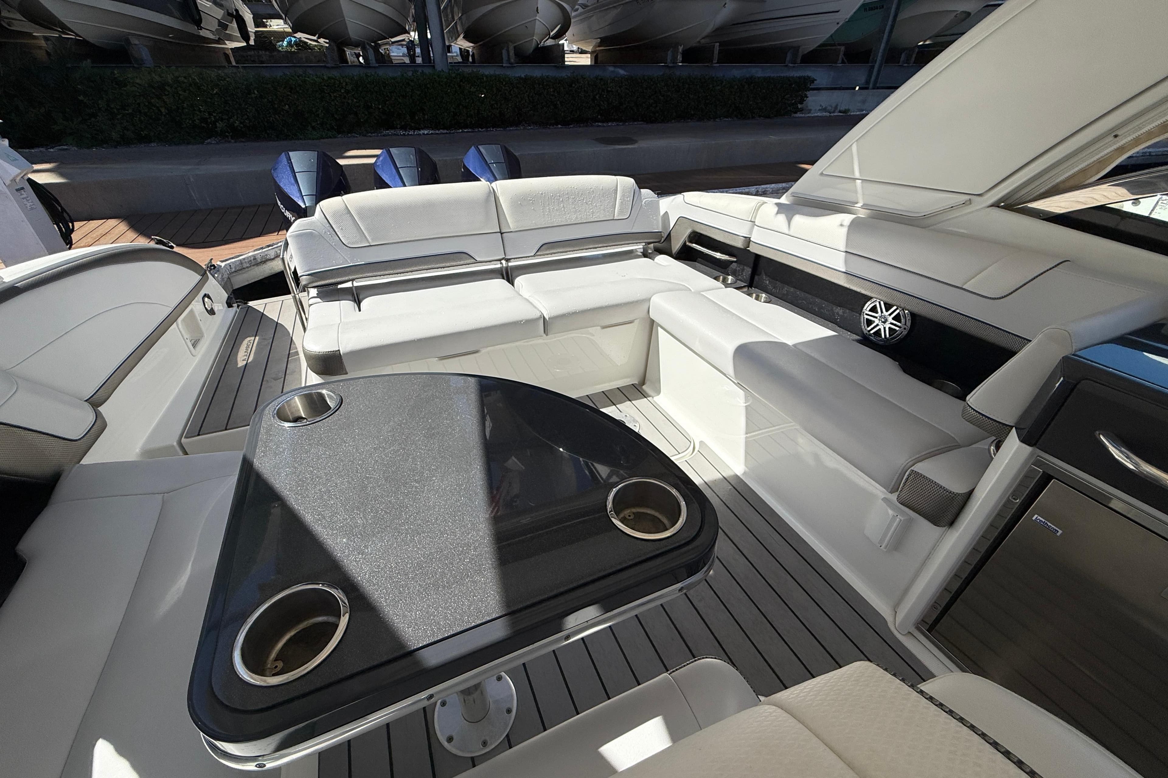 Luxurious interior of 2021 Formula 330 Crossover Bowrider OB with seating and table.