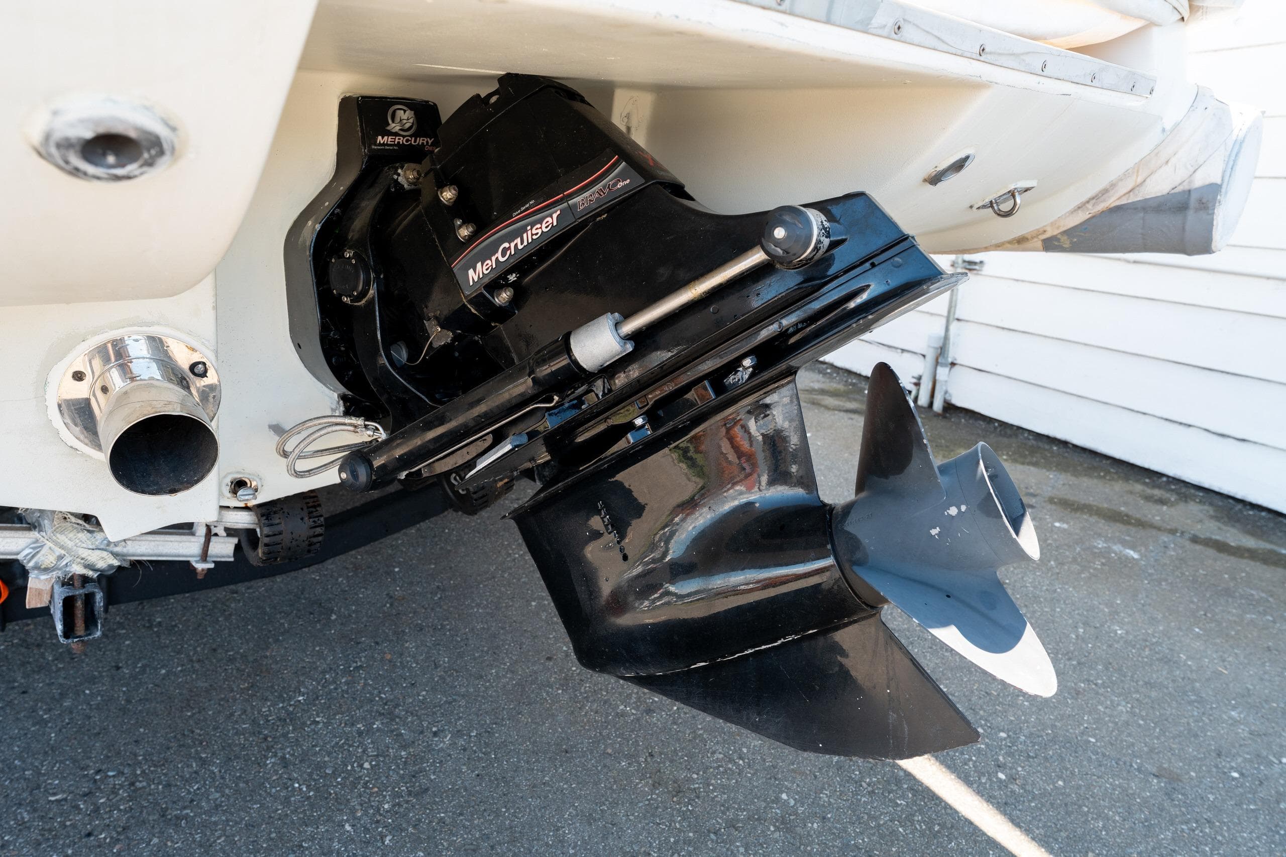 Close-up of a 2007 Nautica RIB 19 boat's MerCruiser engine and propeller.