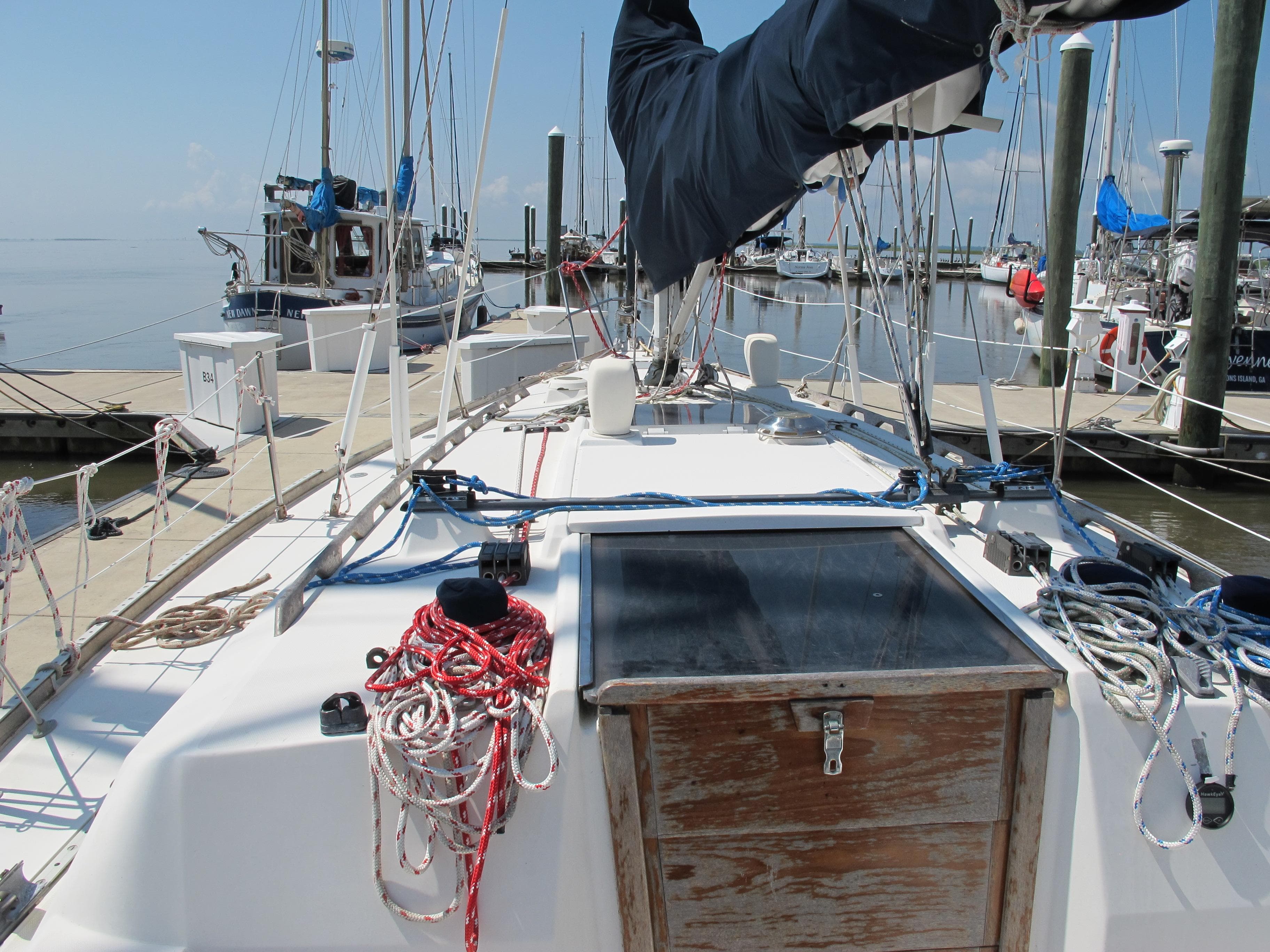 1987 Sabre 34 sailboat deck with ropes and marina view.