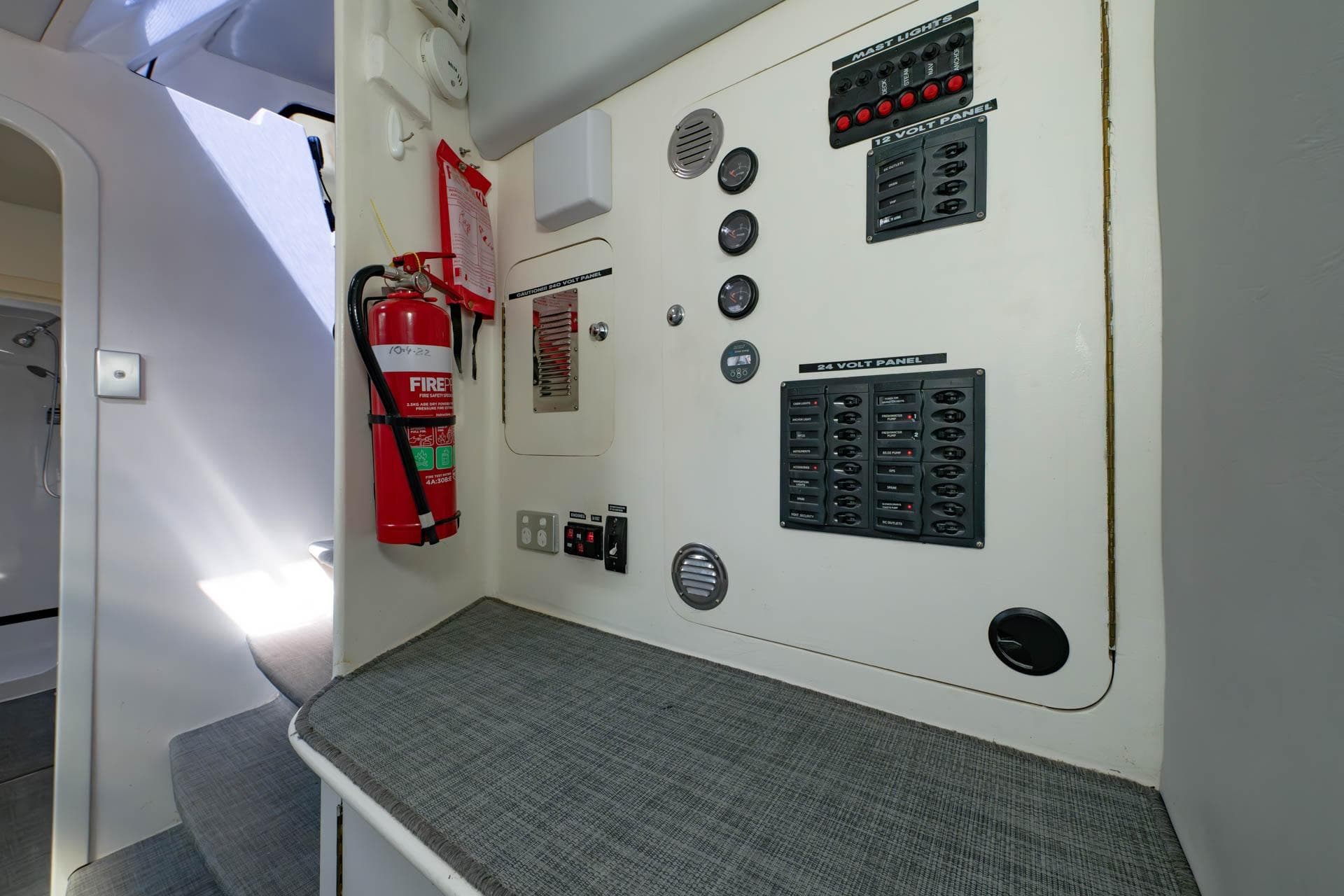 Control panel and fire extinguisher inside 2019 Schionning G Force 17C catamaran.