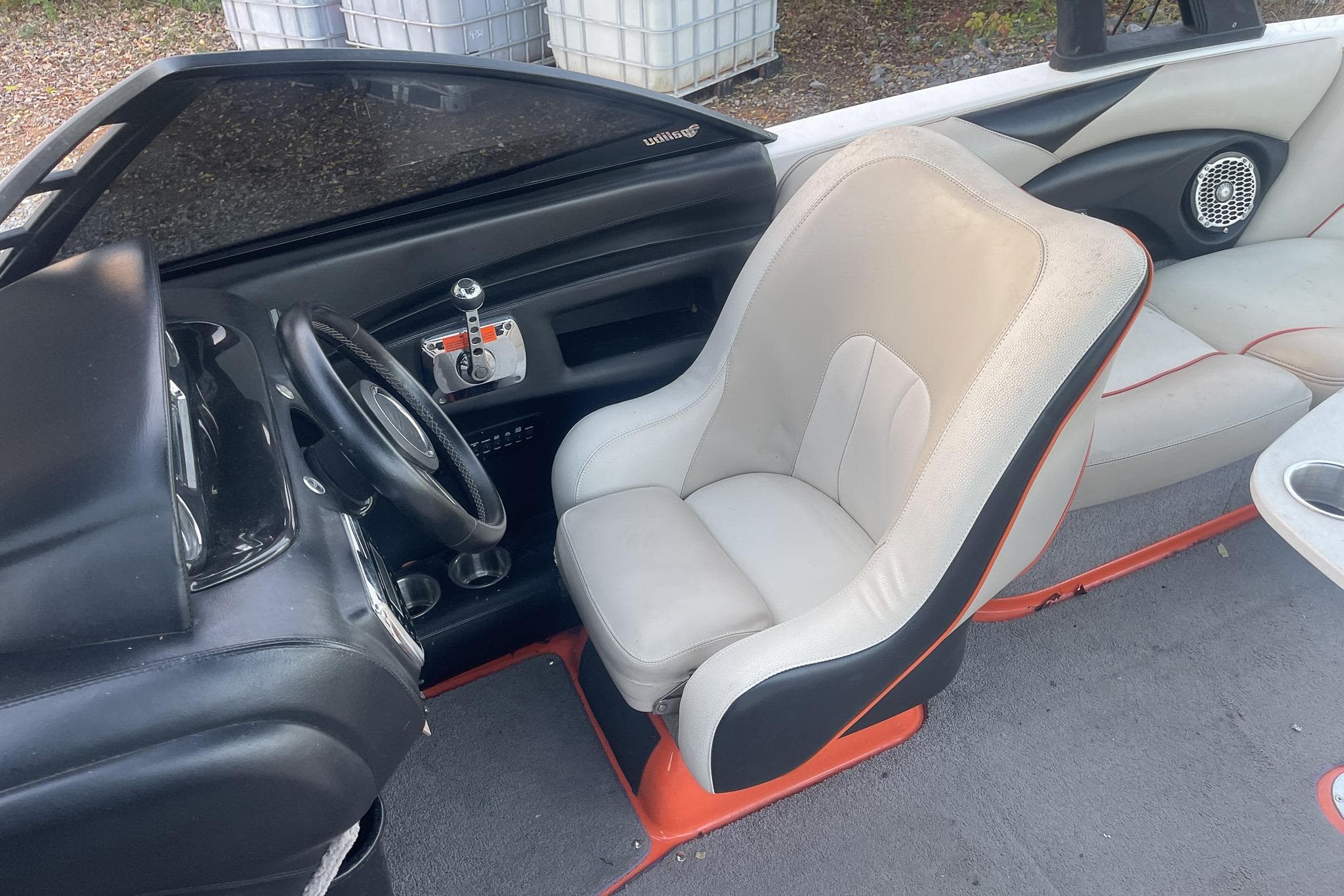 2011 Malibu Wakesetter 21 VLX boat interior with steering wheel and captain's seat.