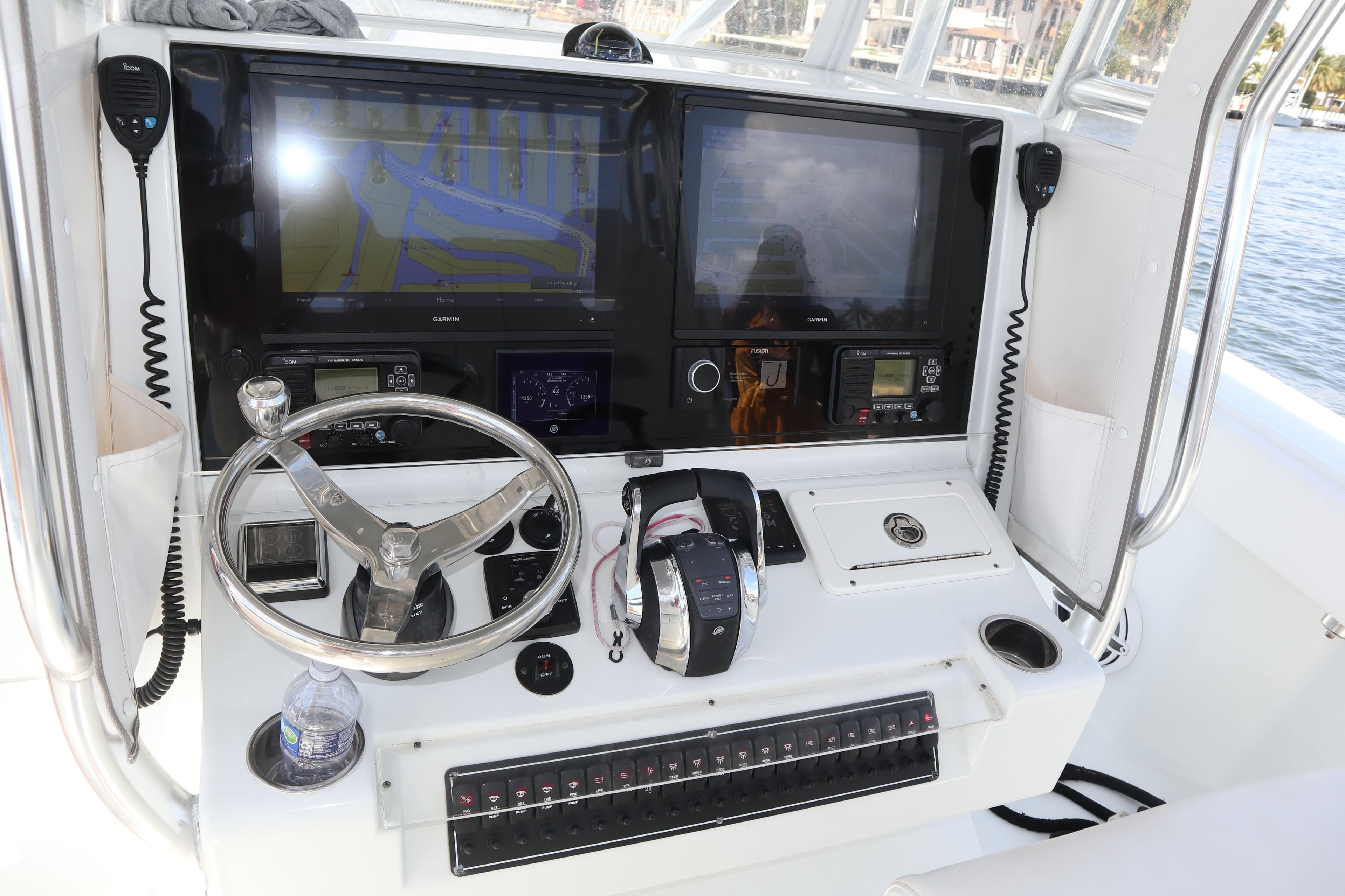 2022 Freeman 34VH boat helm with dual screens, steering wheel, and control panel.