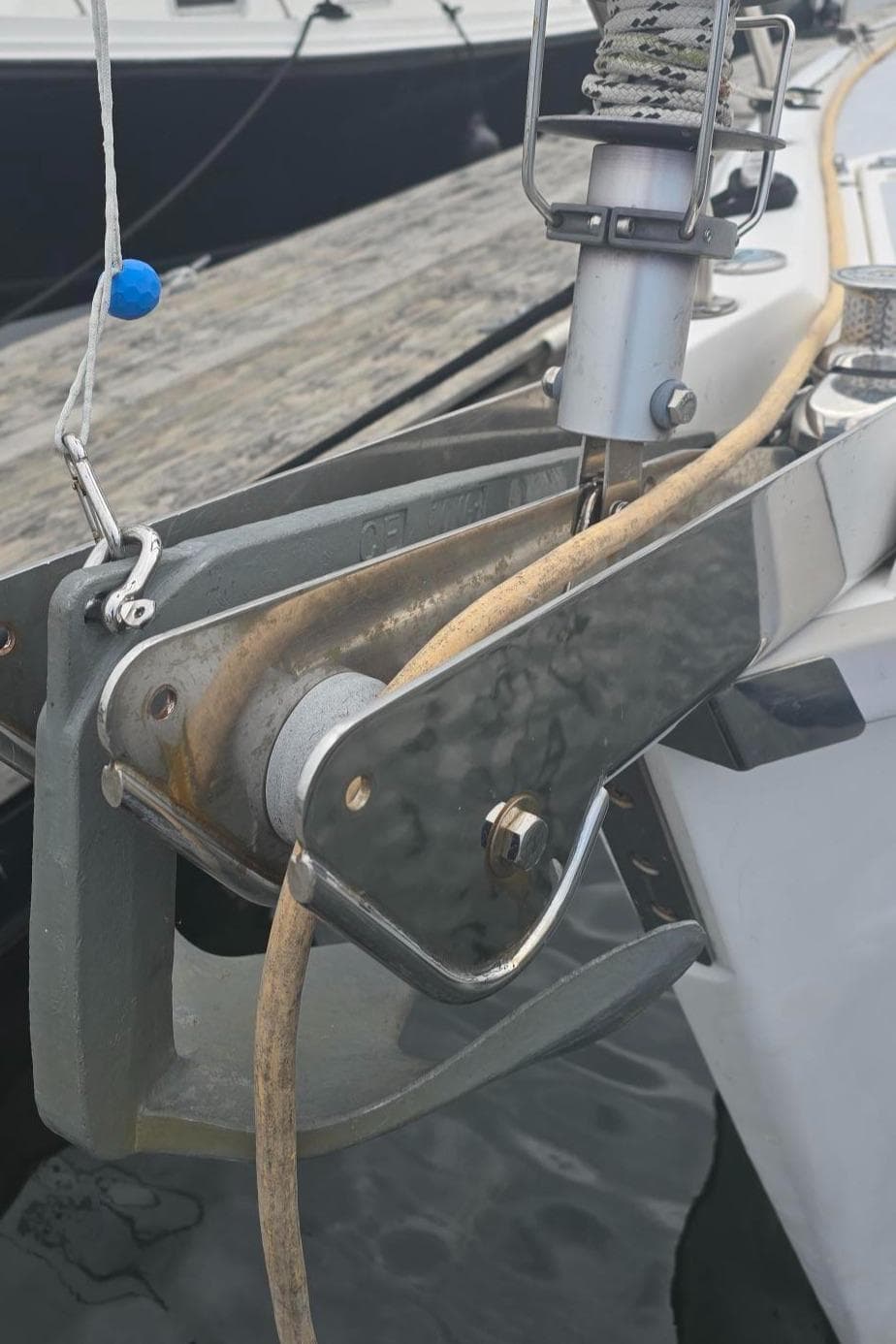 Close-up of a 1997 Hunter 336 sailboat anchor system at a dock.