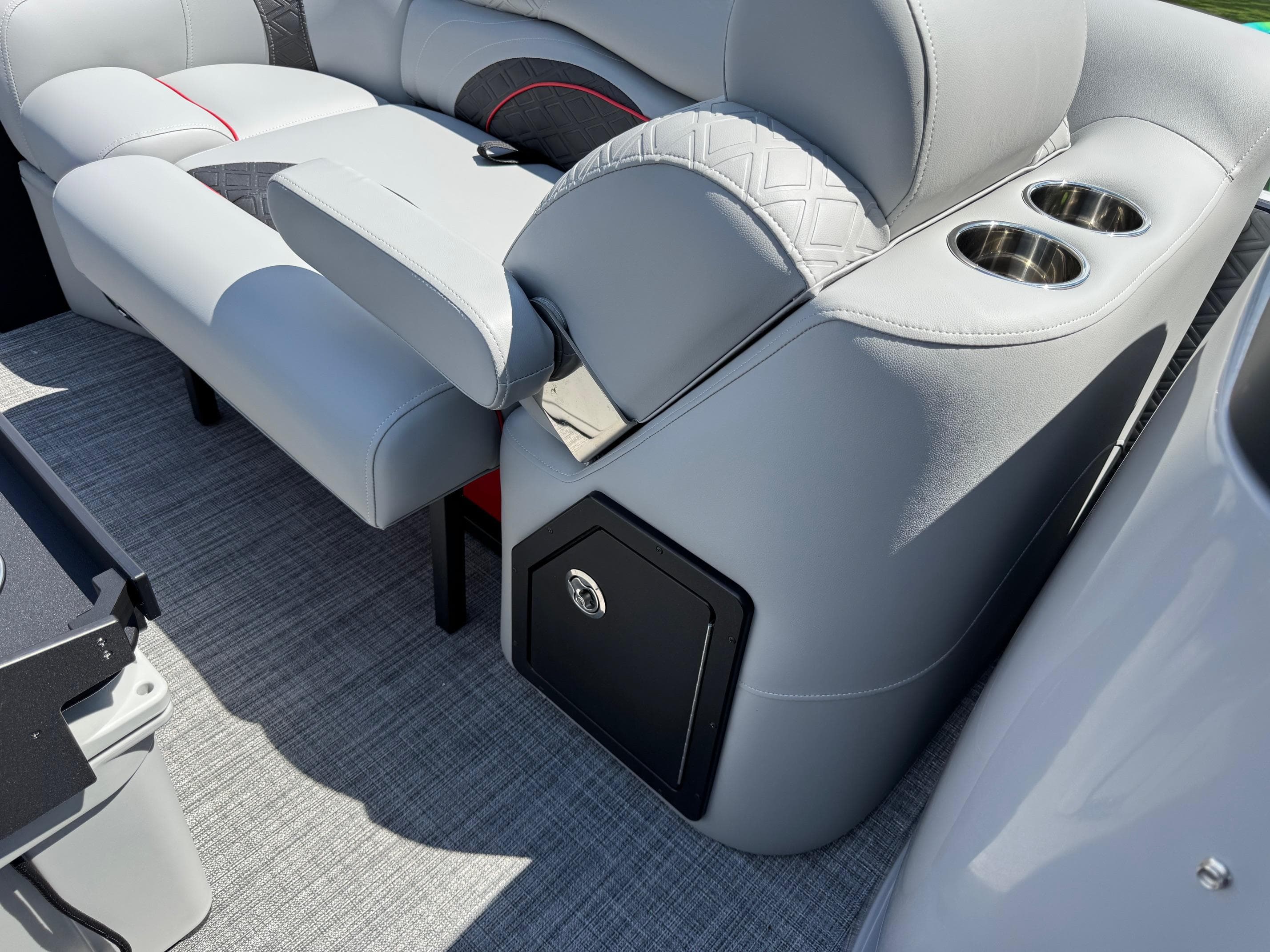 Luxurious seating on 2026 JC SportToon 24 TT DSL pontoon boat with cup holders and storage.