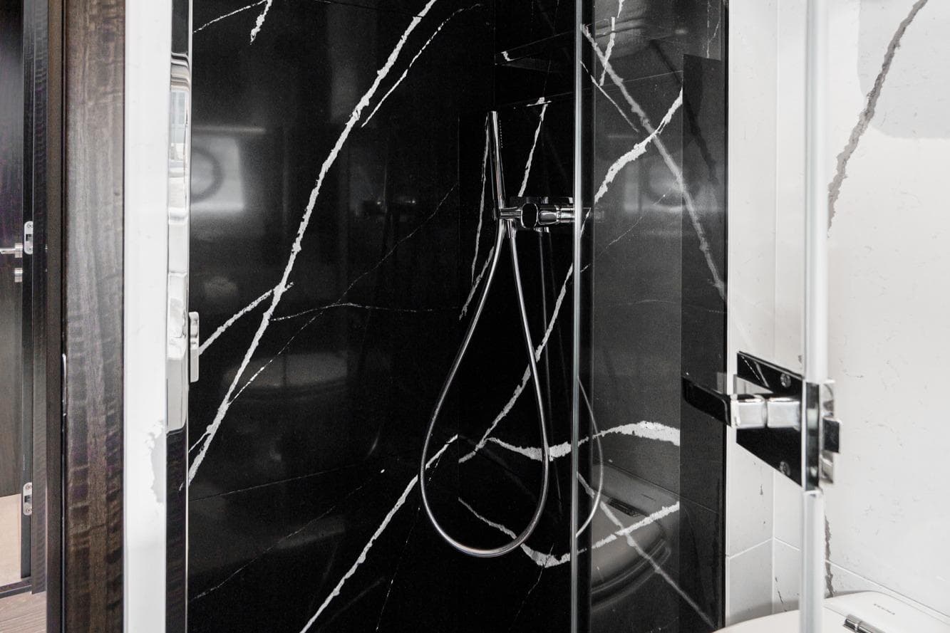 Luxurious shower in Sunseeker Manhattan 68 yacht, 2023 model.