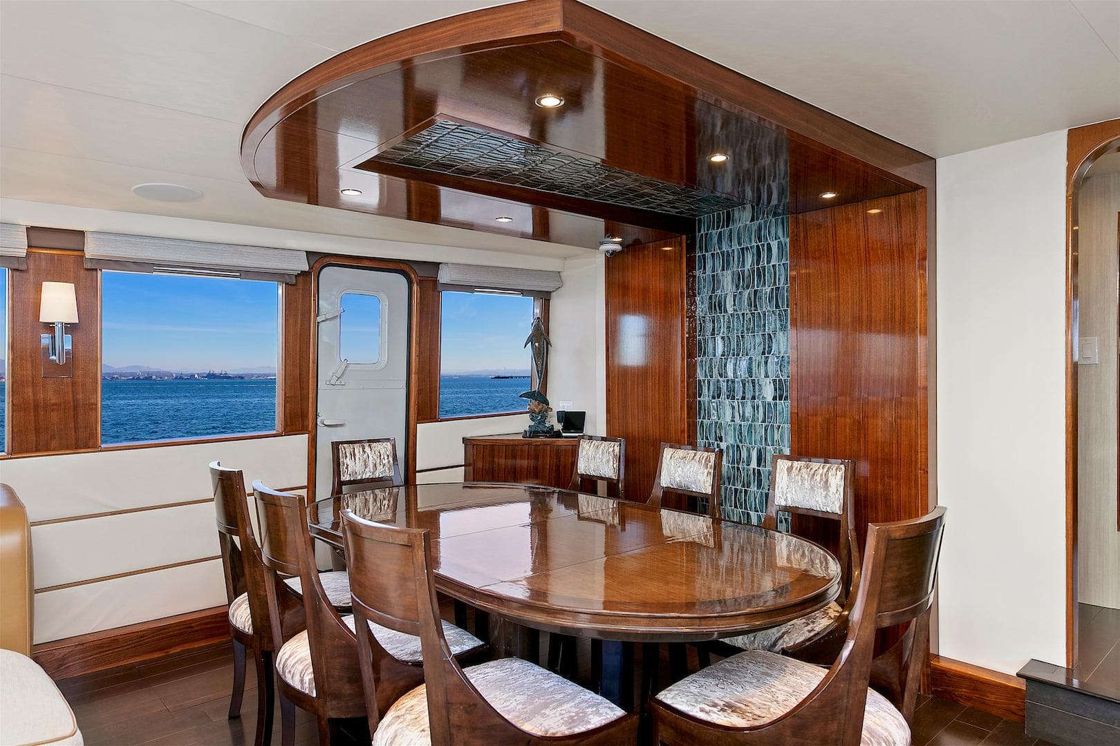 Luxurious dining area on 1987 Deep Sea Marine motor yacht with ocean view.