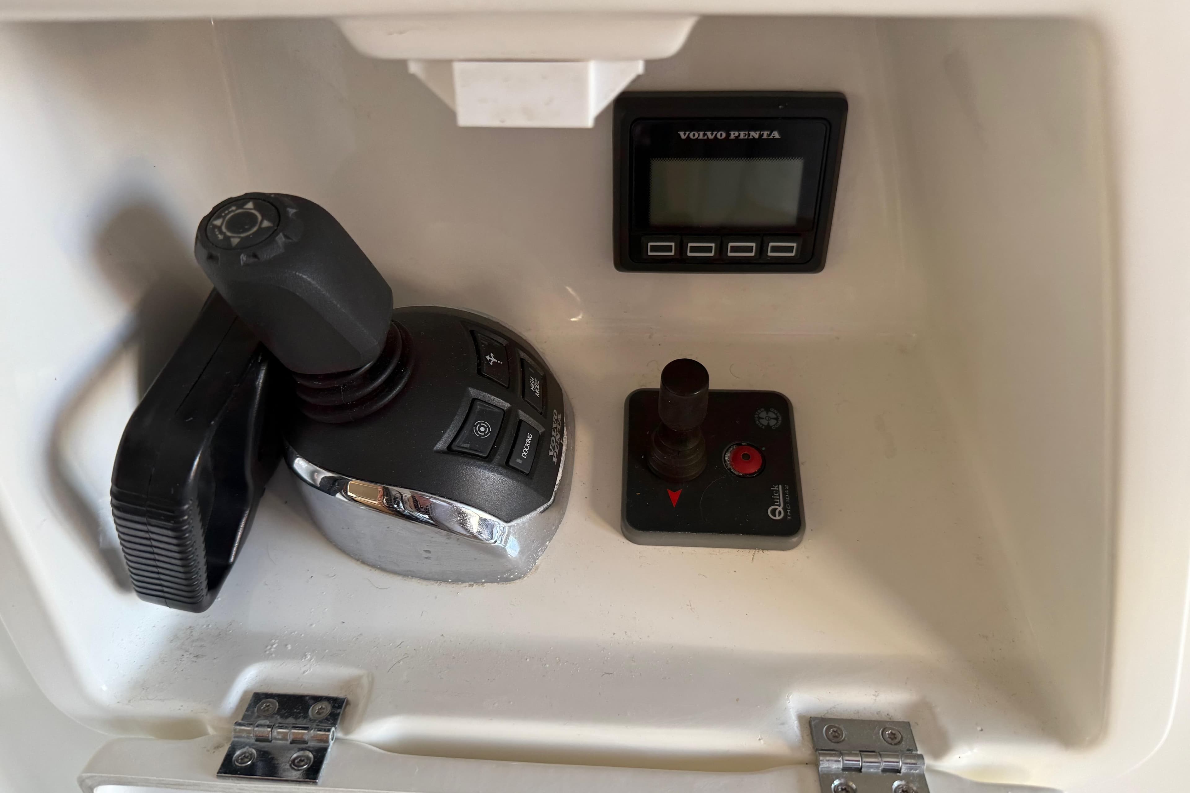 Control panel of a 2018 Prestige 500 yacht featuring joystick and Volvo Penta display.