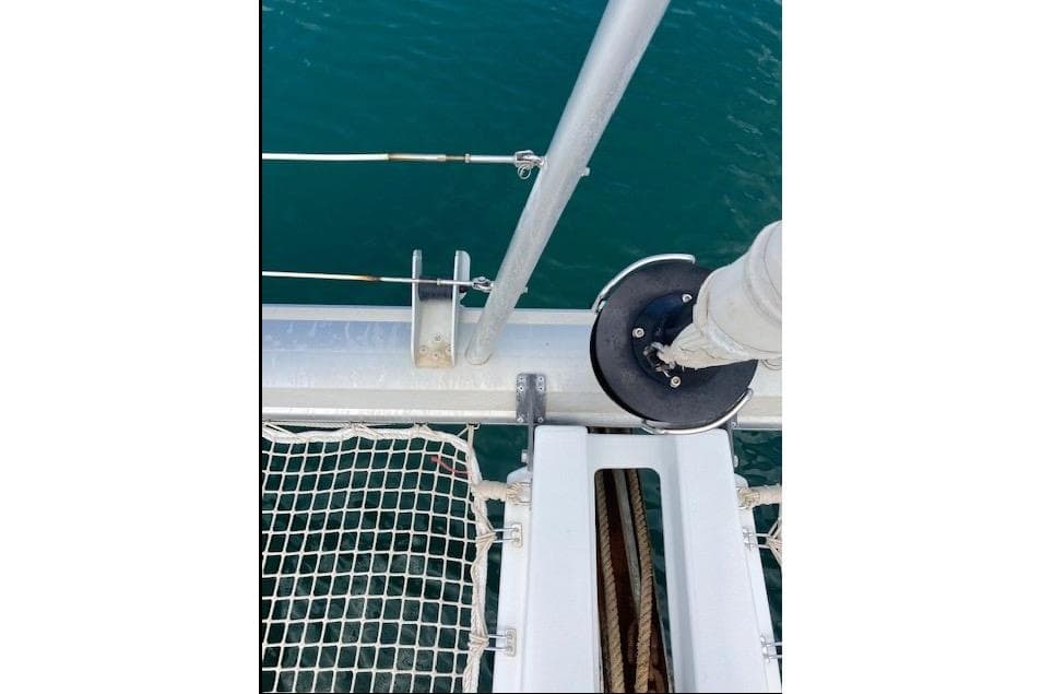 Close-up of Lagoon 450 F catamaran deck details, featuring netting and rigging components.