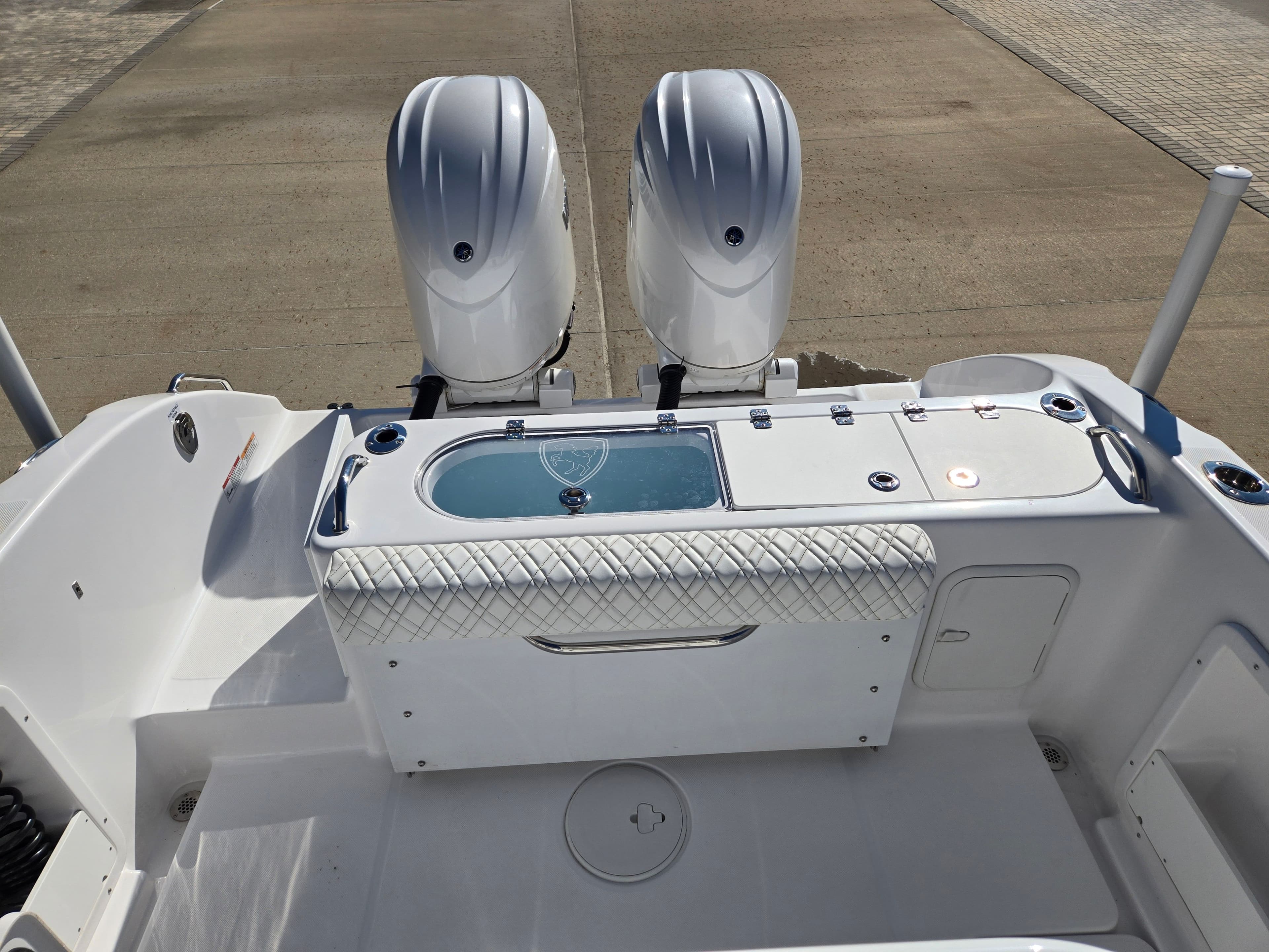 Rear view of 2024 Century 2600 boat with dual engines.