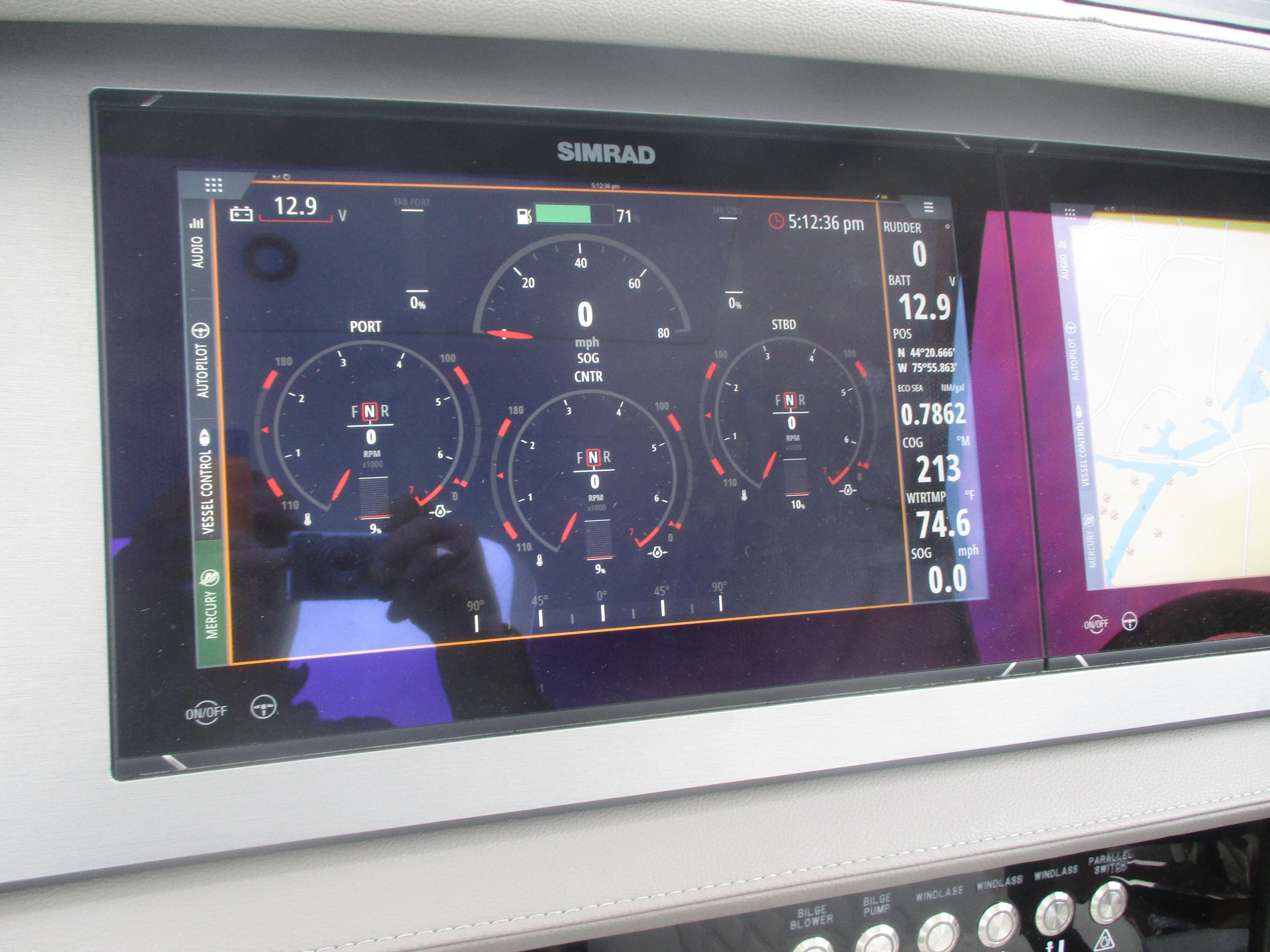 Simrad display on 2021 Sea Ray 400 SLX Outboard showing engine and navigation data.