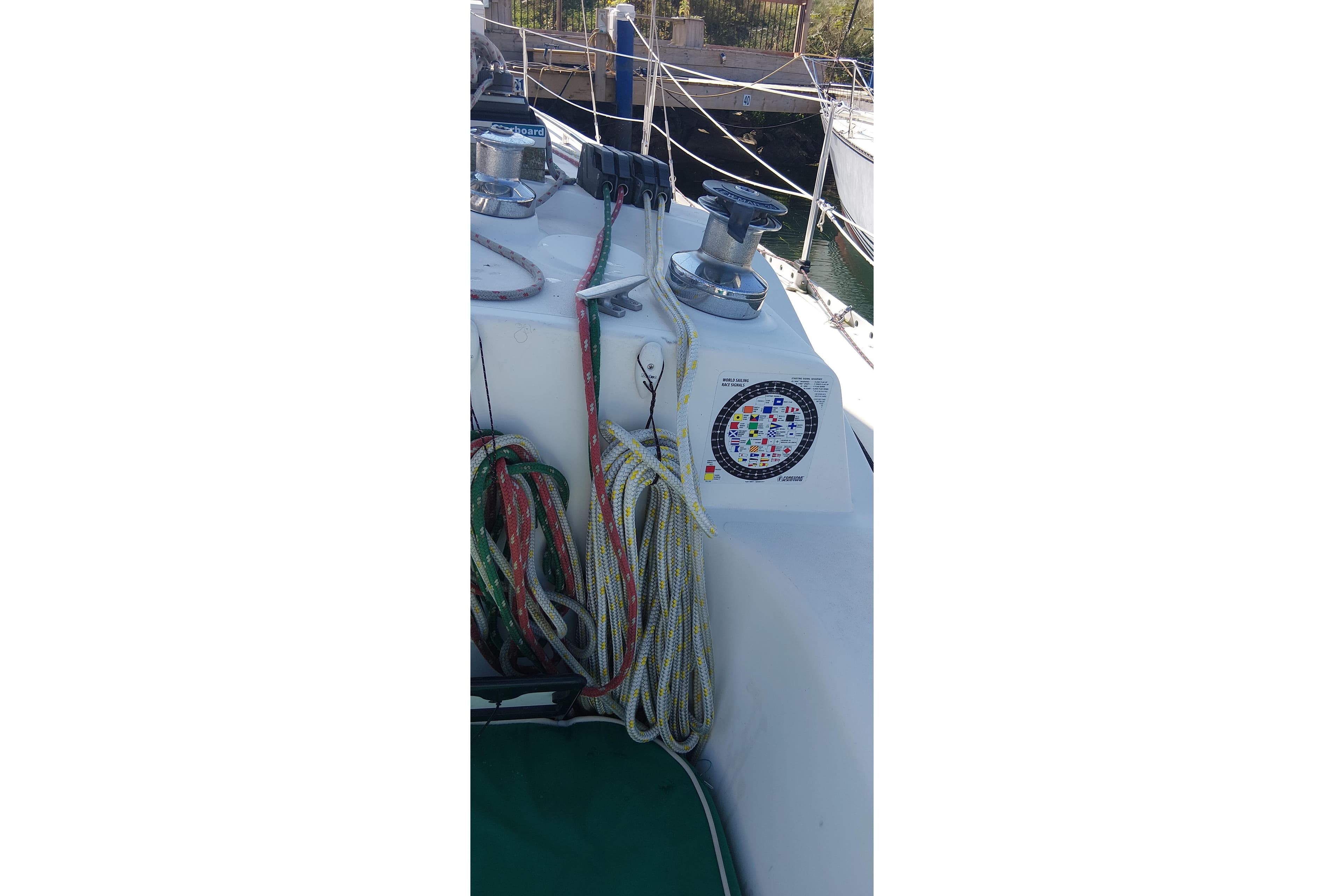 1983 CS 36 Traditional sailboat deck with colorful ropes and winch.