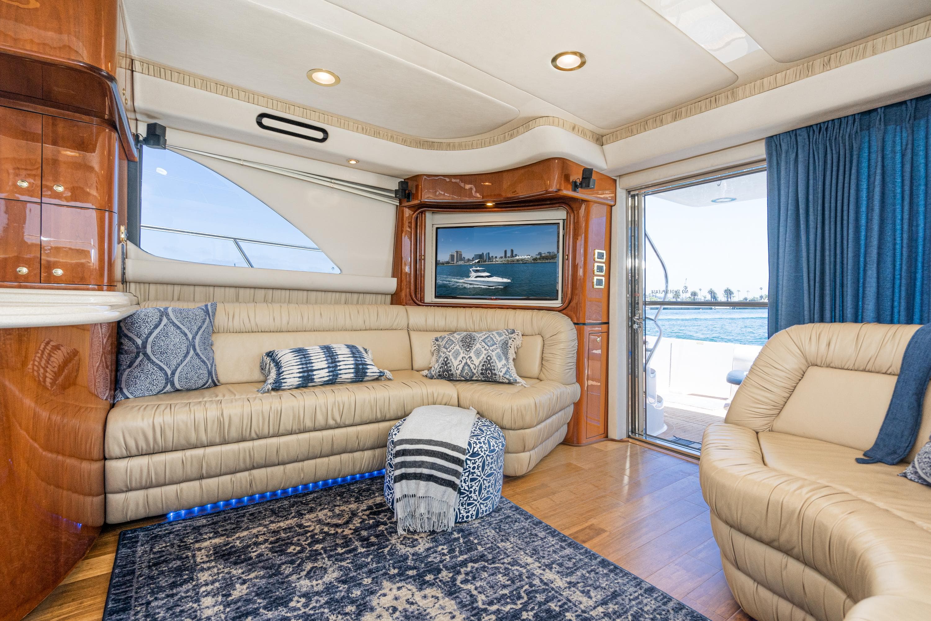 Luxurious interior of 2001 Sea Ray 560 Sedan Bridge yacht with plush seating and elegant decor.