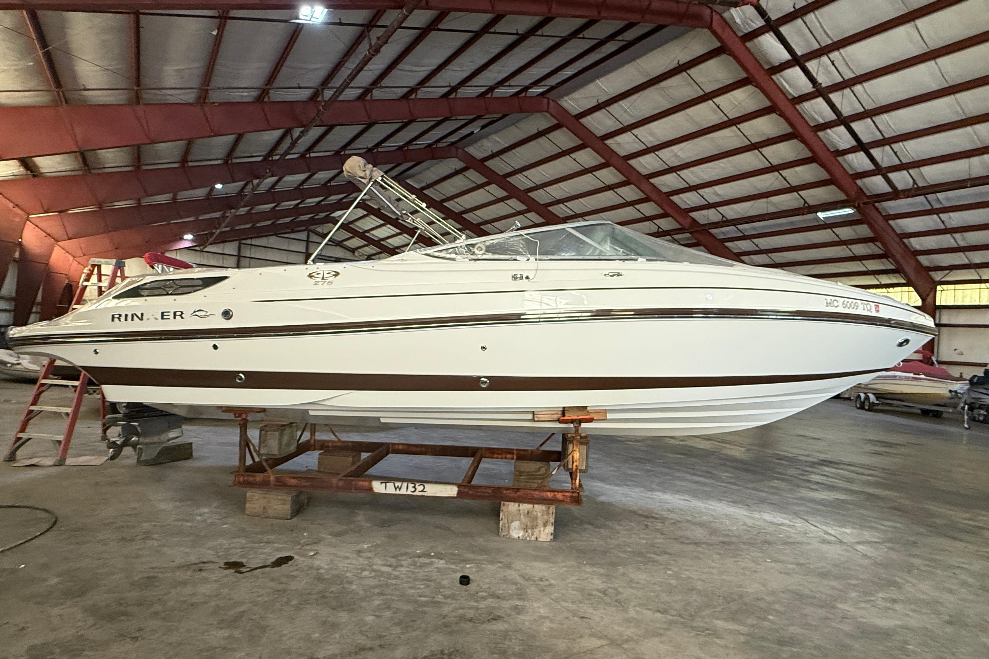 2013 Rinker 276 Captiva Bowrider in a spacious indoor storage facility.