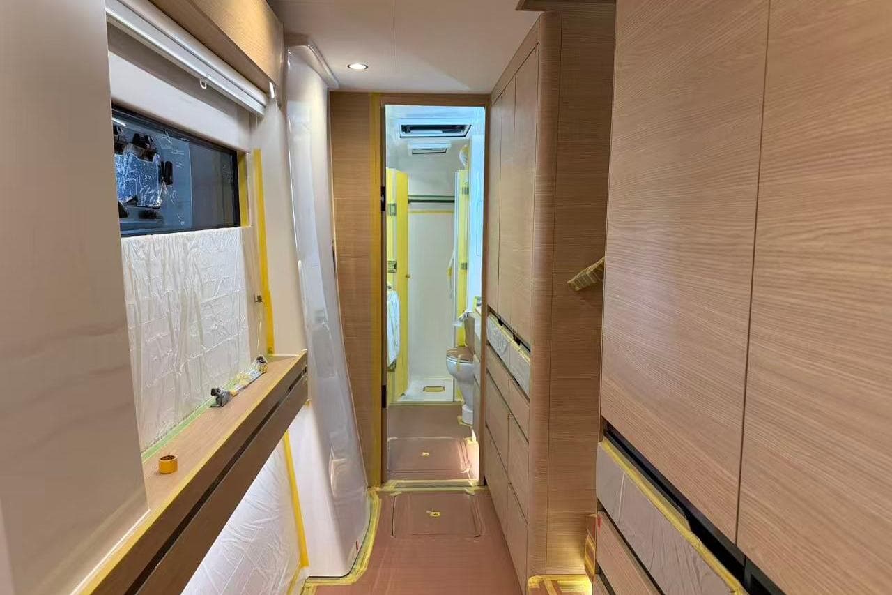 Interior of 2026 HH Catamarans HH44 SC, featuring modern wood paneling and sleek design.