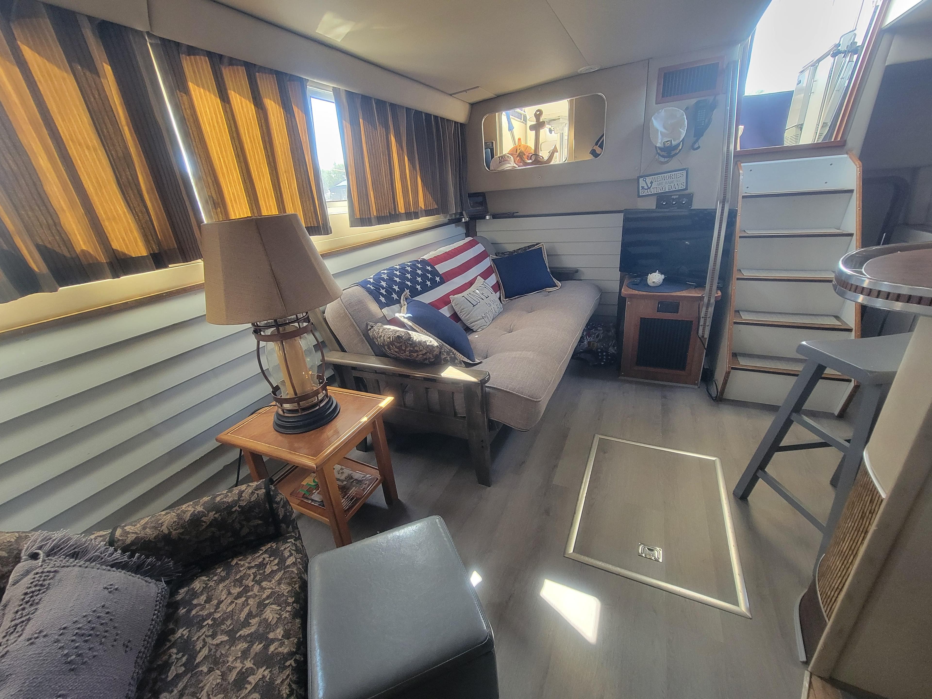 Interior of 1986 Chris-Craft 381 Catalina yacht with cozy seating and decor.