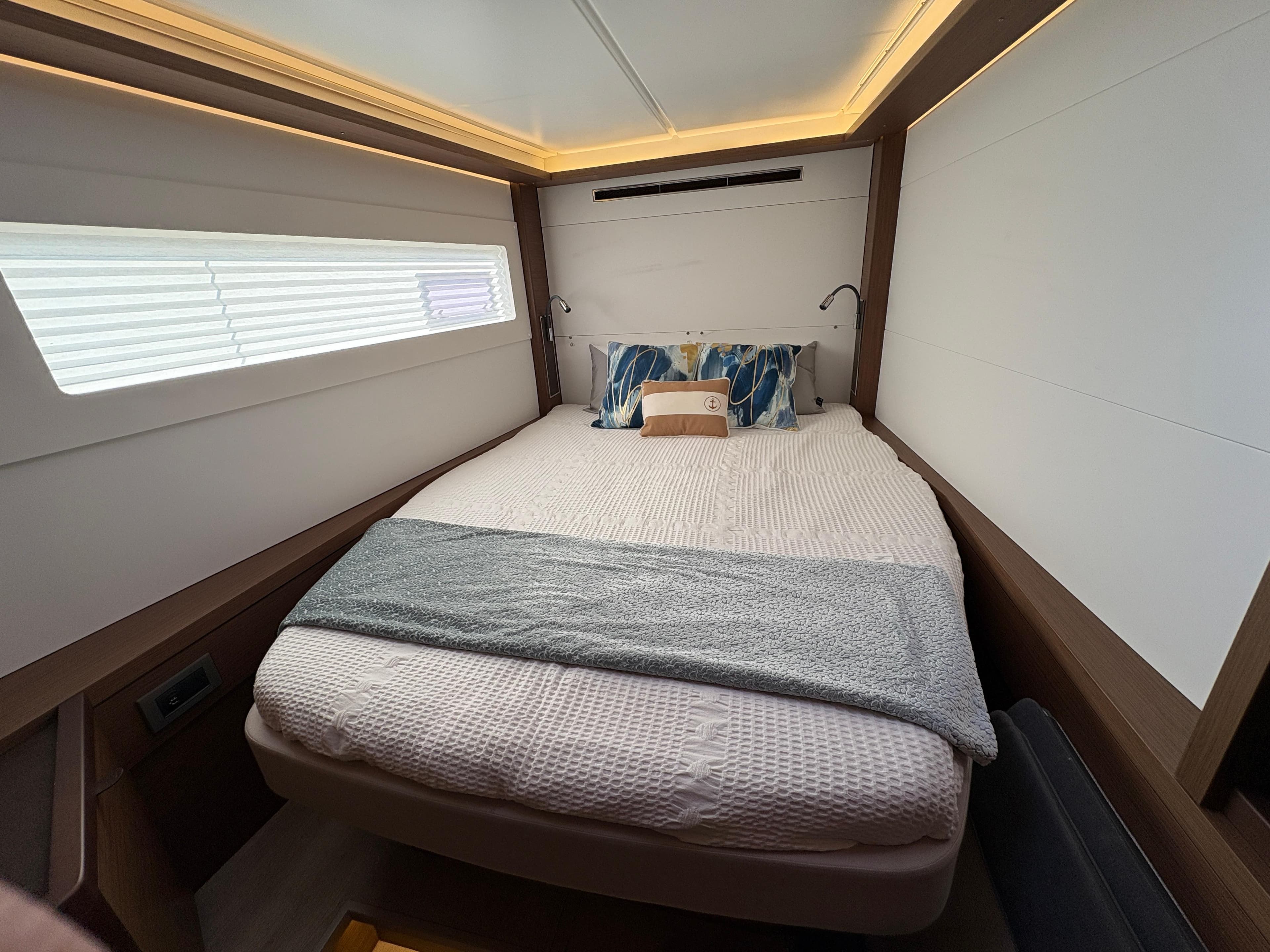 Luxurious cabin interior of 2018 Dufour 560 Exclusive yacht with cozy bedding.