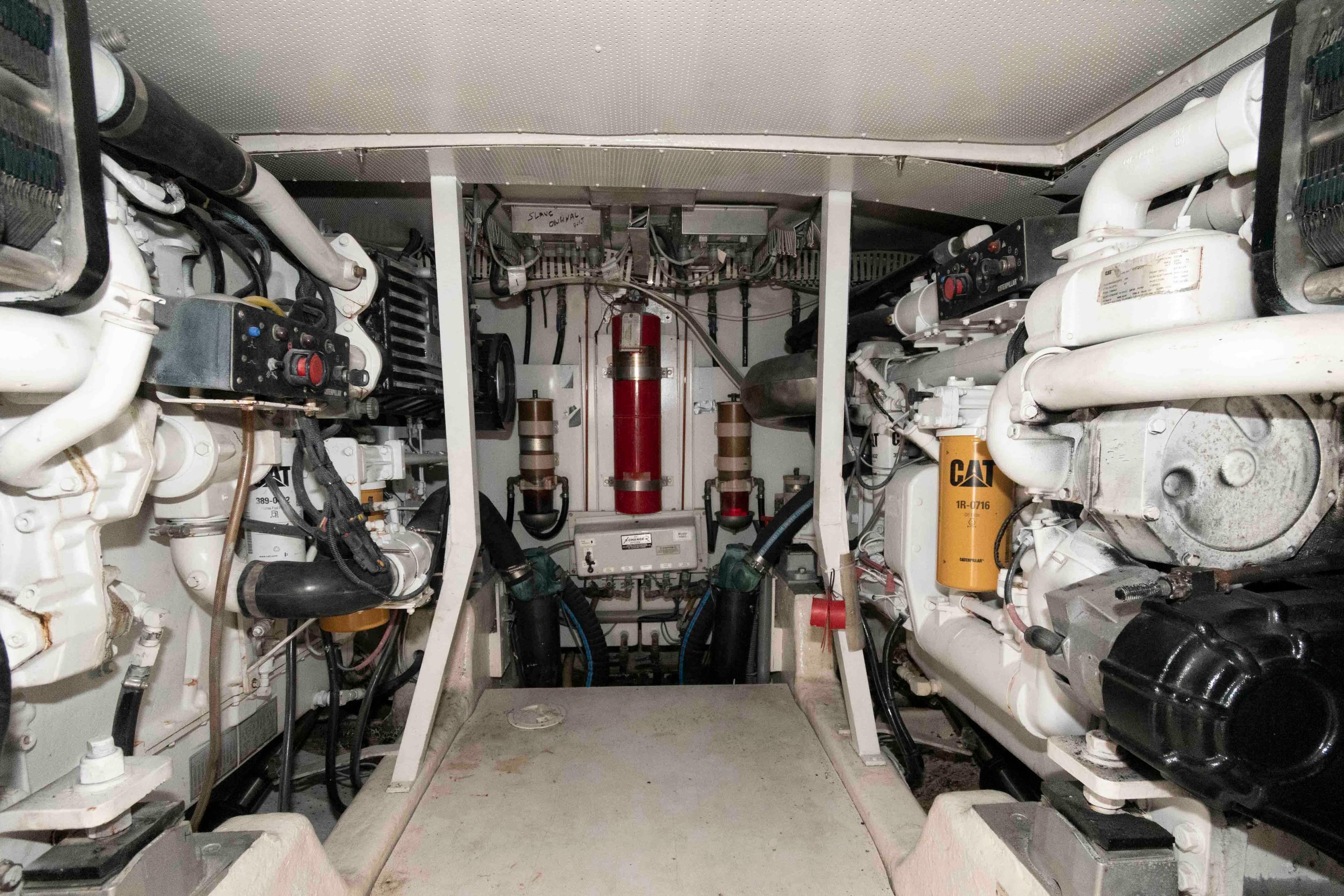 Engine room of 2003 Neptunus 56 Flybridge yacht, featuring dual Caterpillar engines.