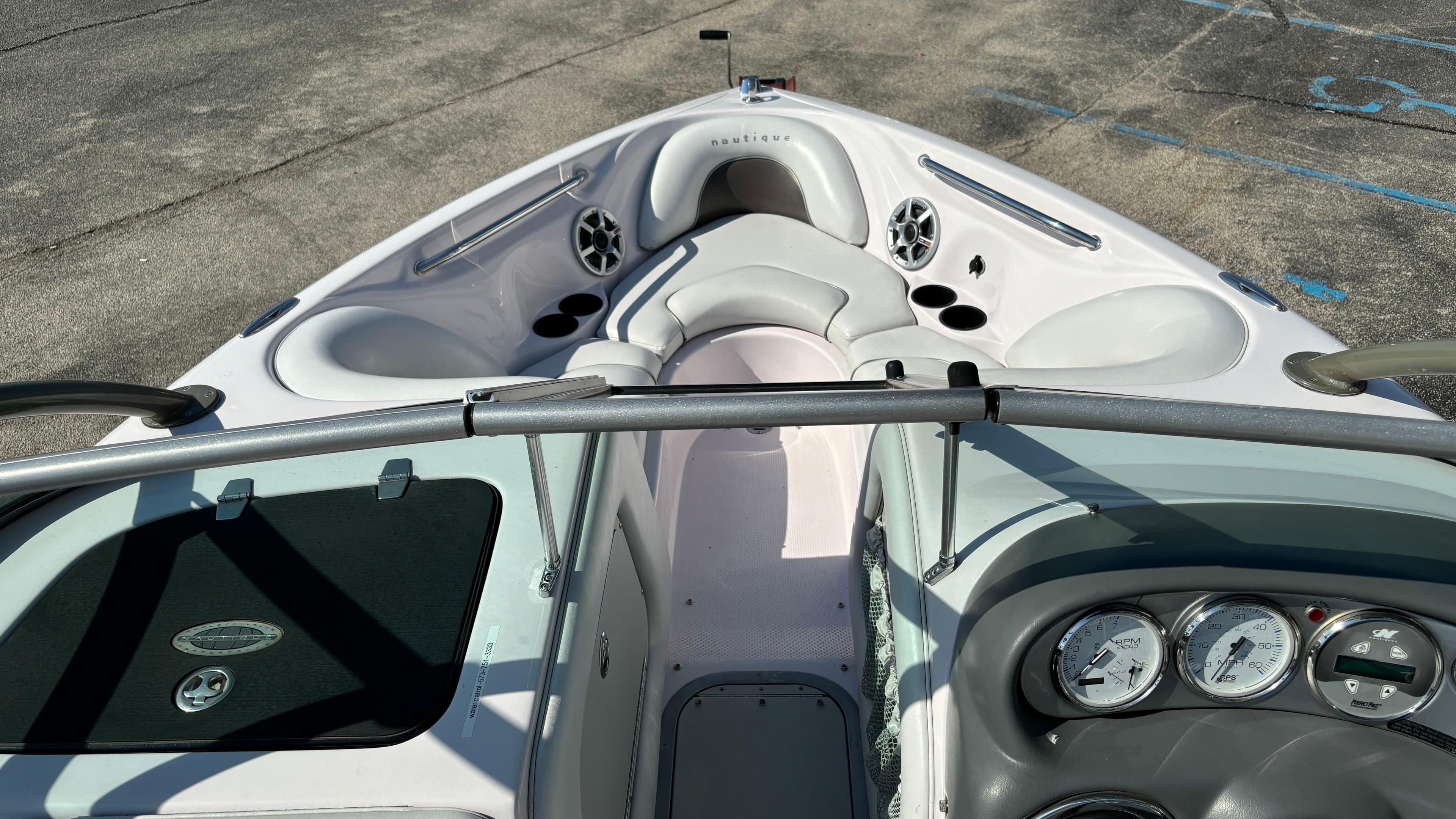 2005 Correct Craft SV211 Nautique Air boat interior with seating and dashboard.