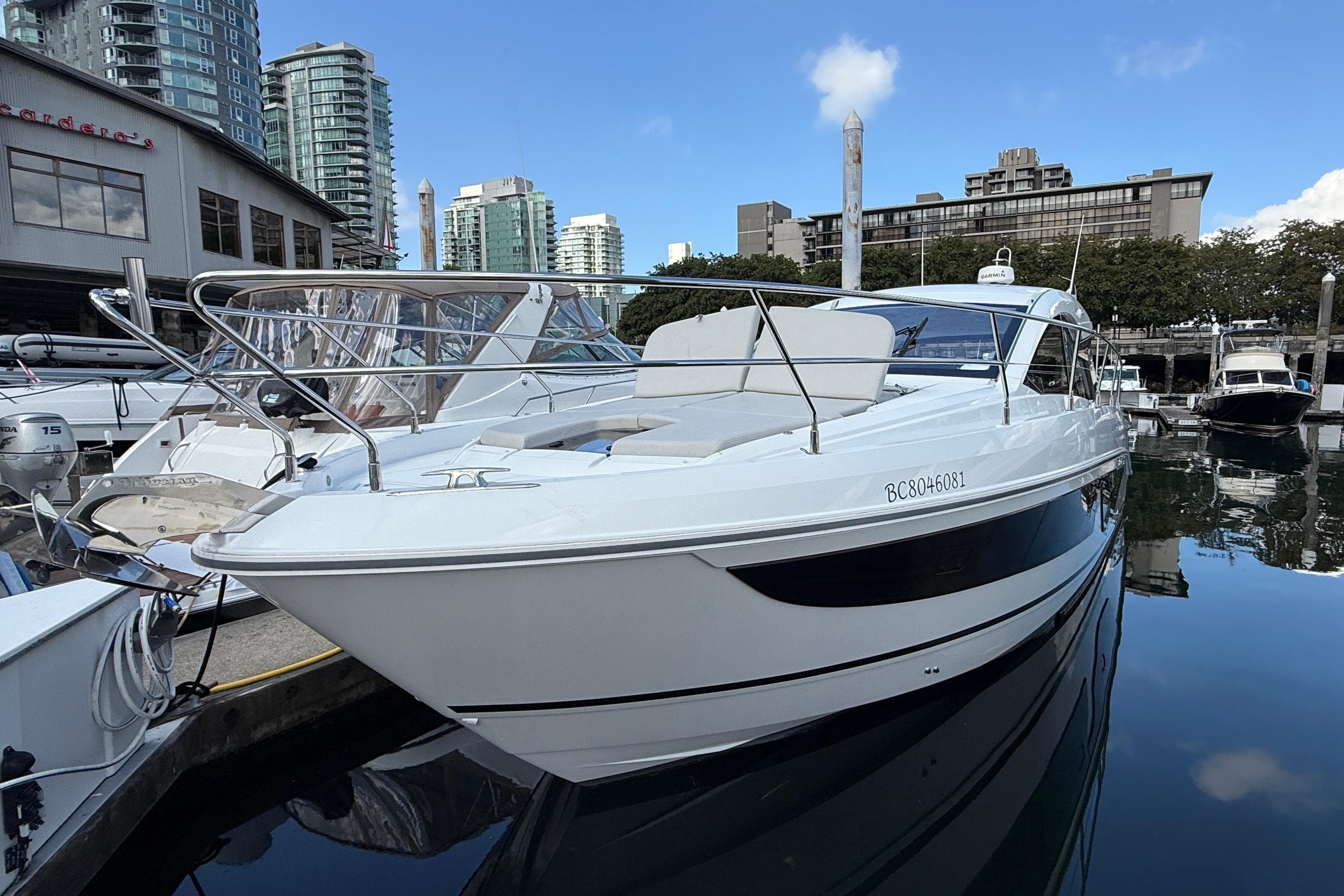 2022 Beneteau Gran Turismo 41 yacht docked in urban marina setting.