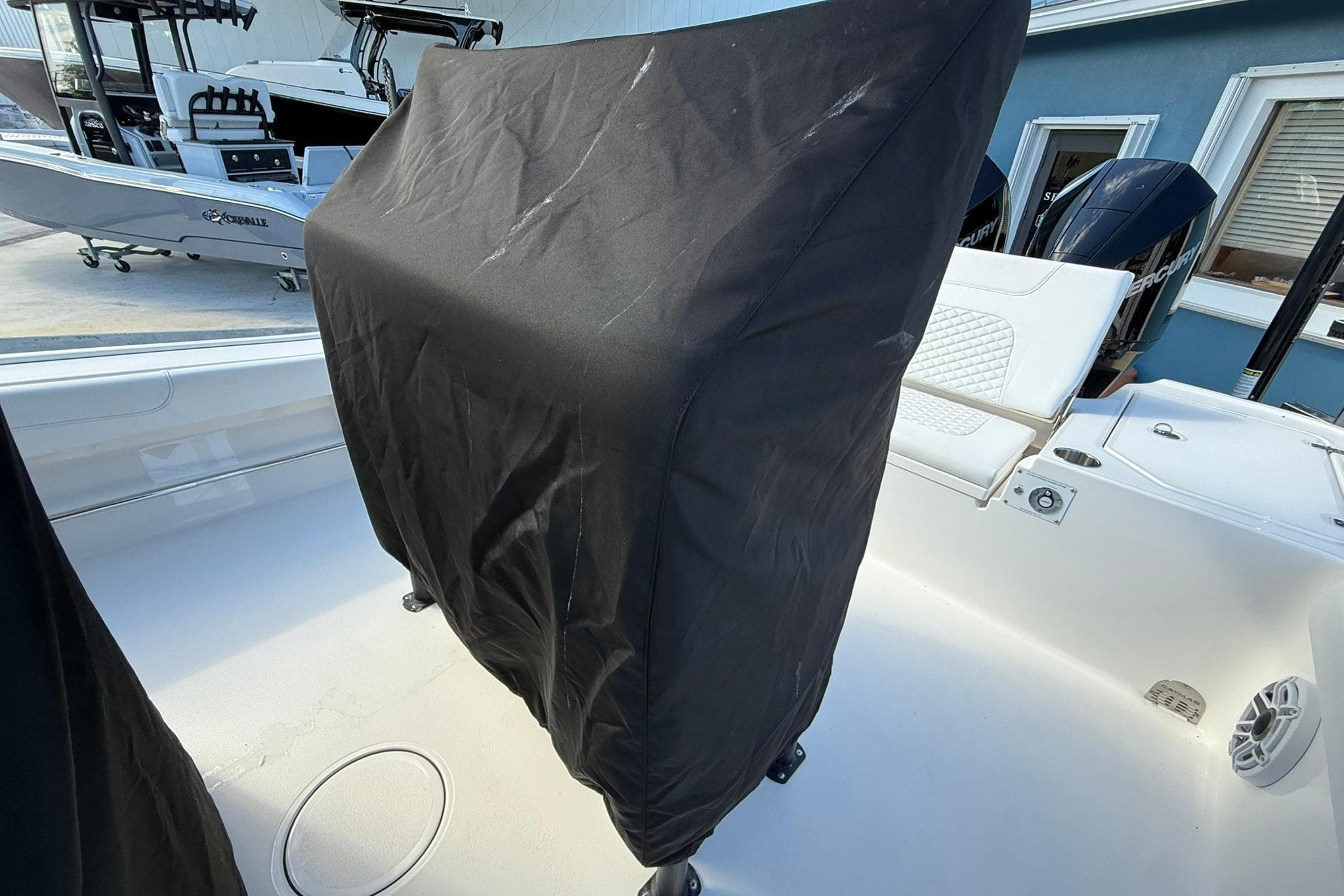 2023 Caymas 28 HB Twin boat interior with covered console and seating area.