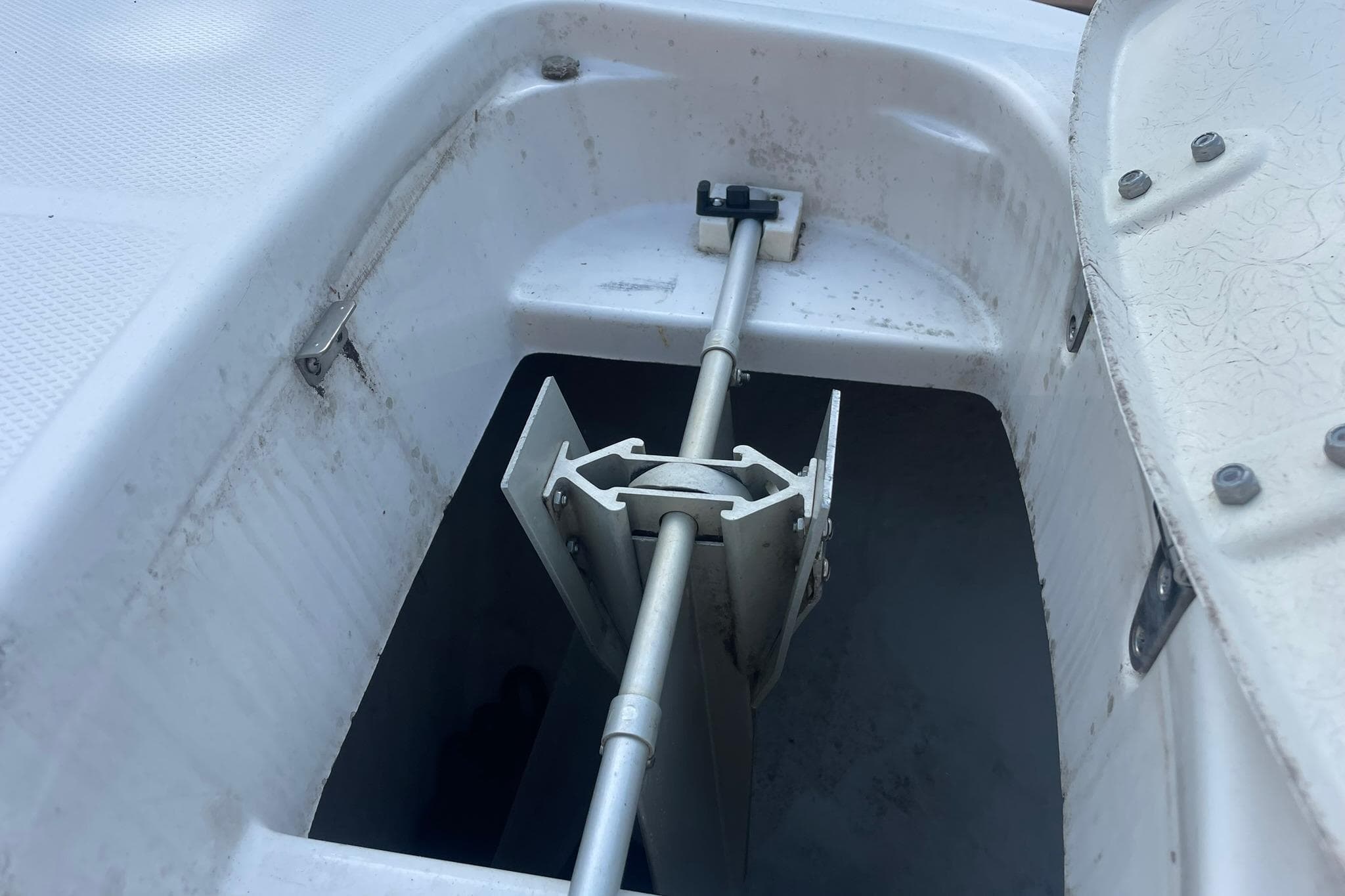 Anchor compartment of a 2005 Chaparral 265 SSi boat, showing anchor storage mechanism.