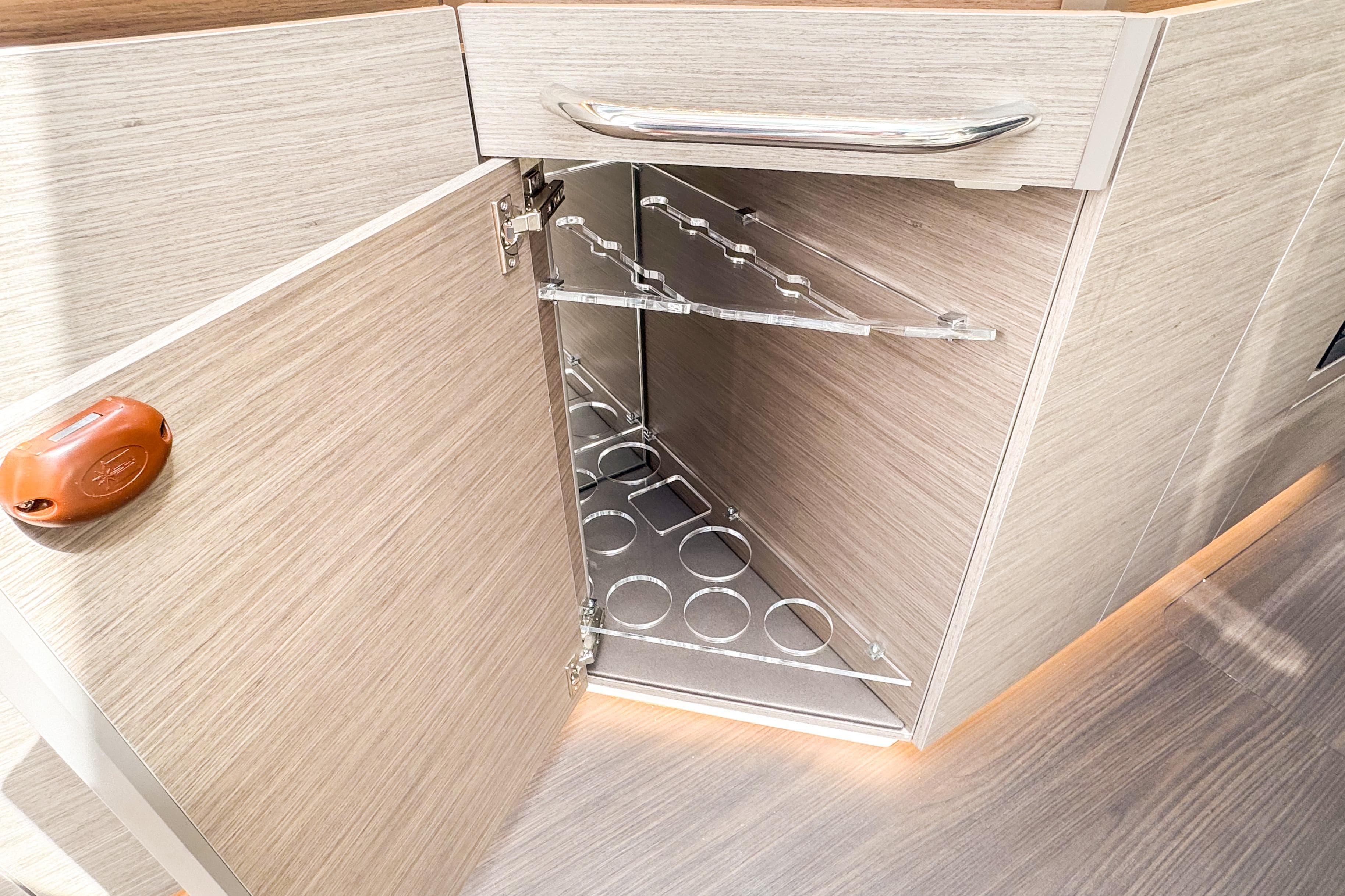 2025 Wellcraft 38 Explorer interior cabinet with wine rack and modern design.