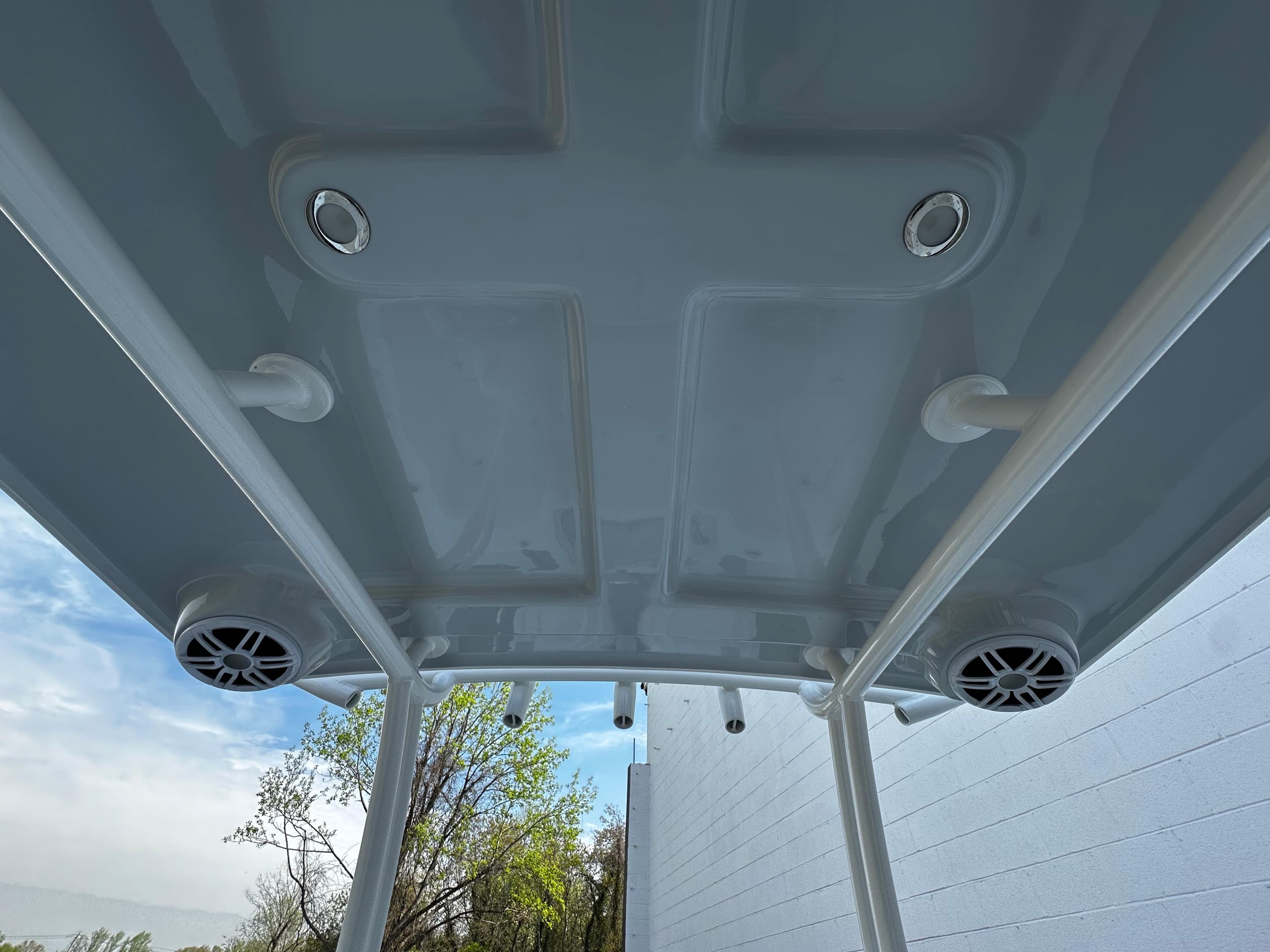 2025 Pair Customs 27 boat canopy with integrated speakers and lights, viewed from below.