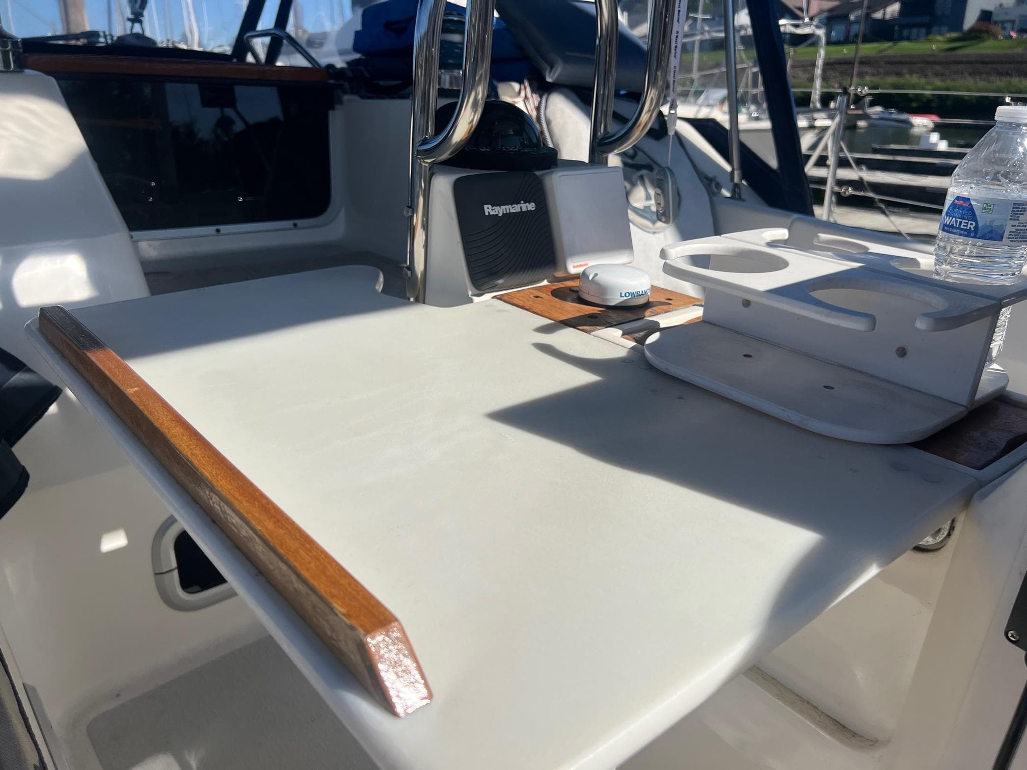 Cockpit of 1992 Hunter 43 sailboat with table and navigation equipment.