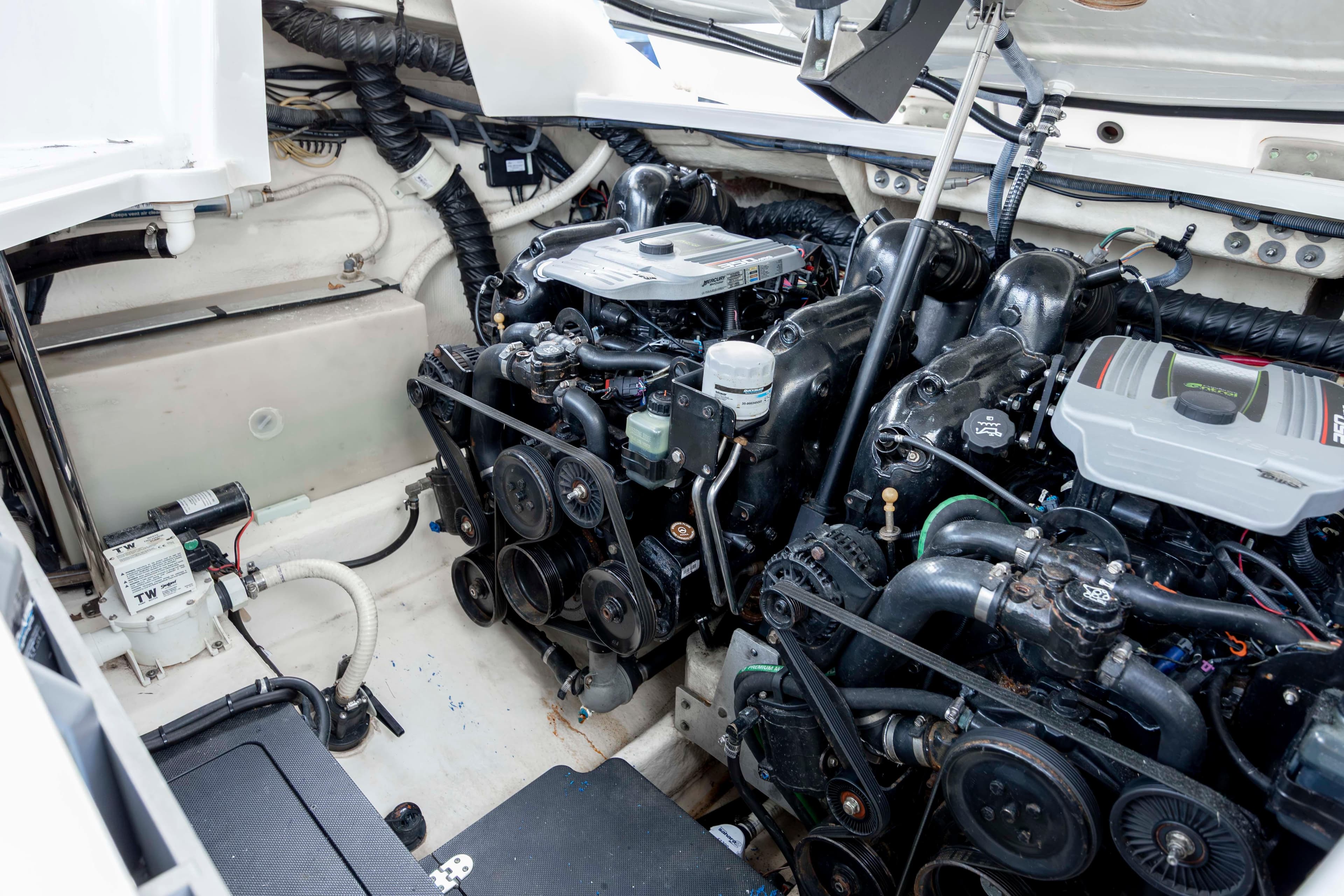 Engine compartment of a 2015 Monterey 328SS Super Sport boat, showcasing dual engines.