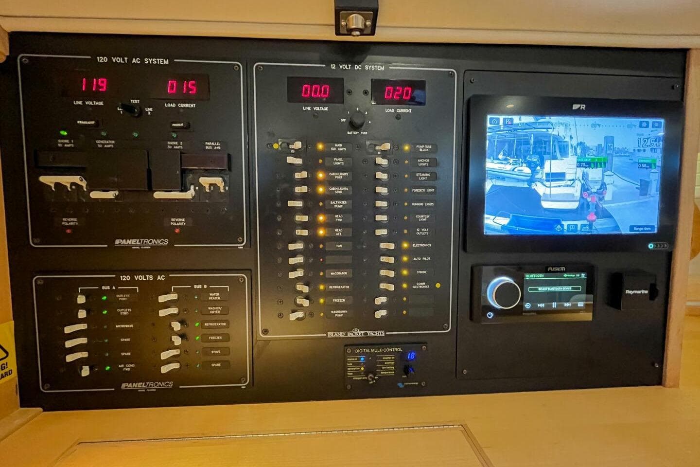 Electrical control panel of 2023 Island Packet 439 yacht with navigation display.