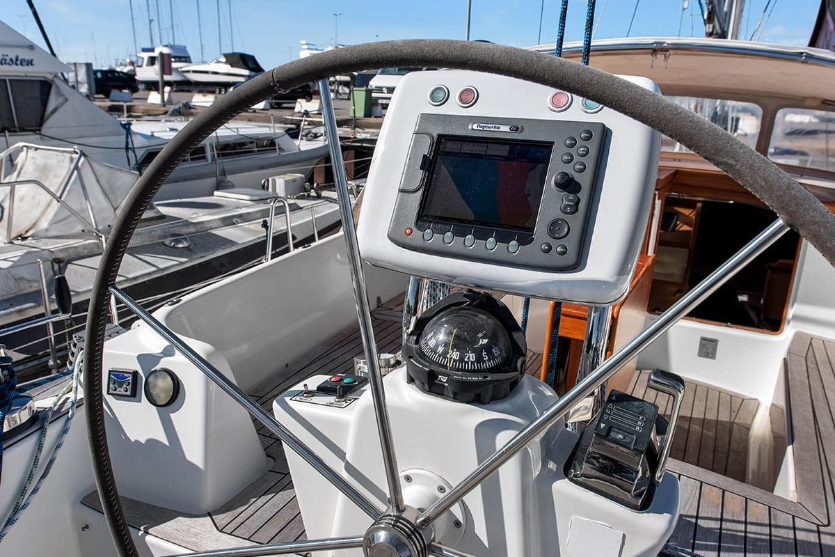 Steering wheel and navigation equipment on a 2007 Nordship 40 DS sailboat.