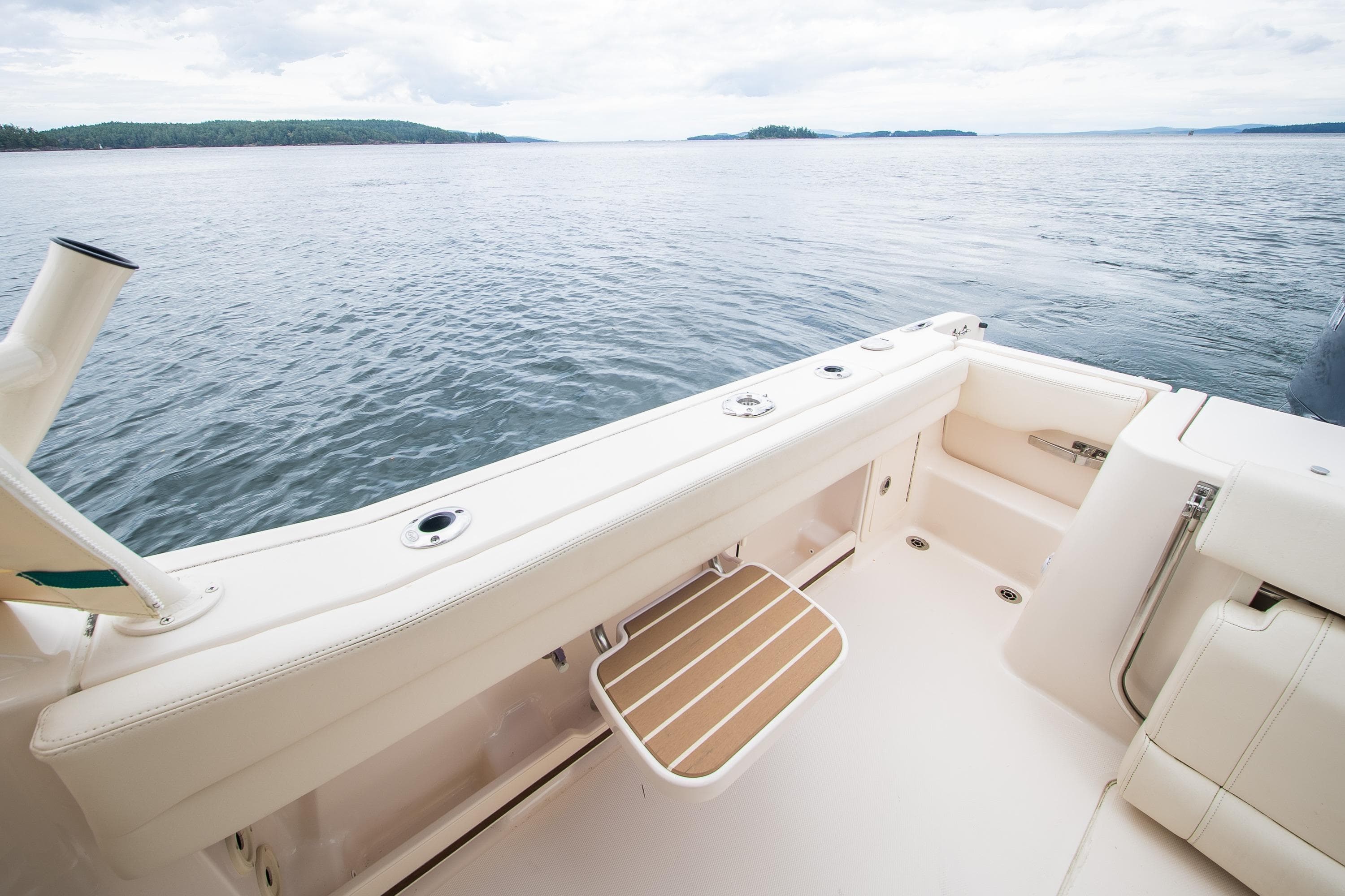 2023 Grady-White Freedom 235 boat interior with ocean view, featuring comfortable seating.