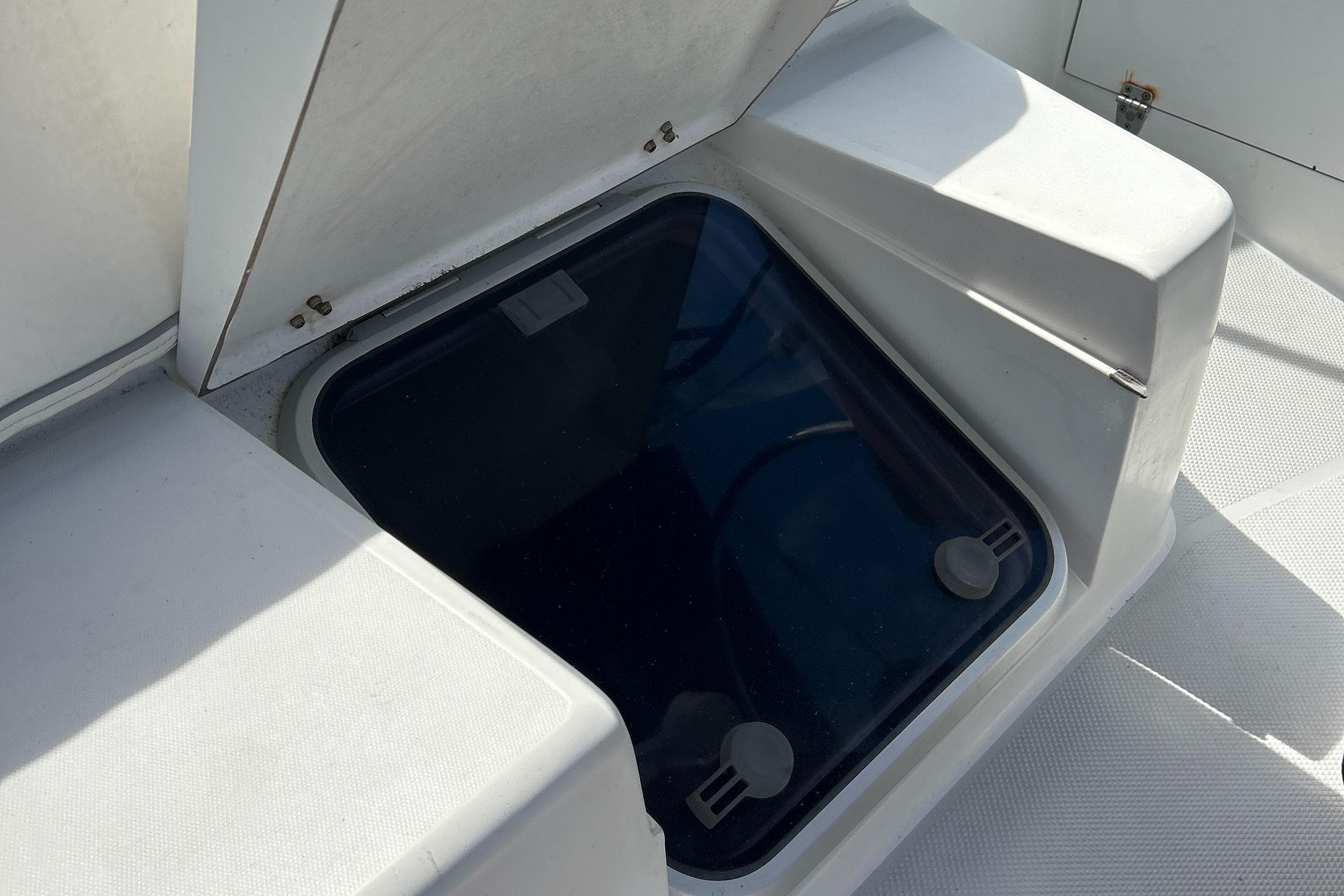 Access hatch on 1998 Catalina 36MKII sailboat deck, open and sunlit.