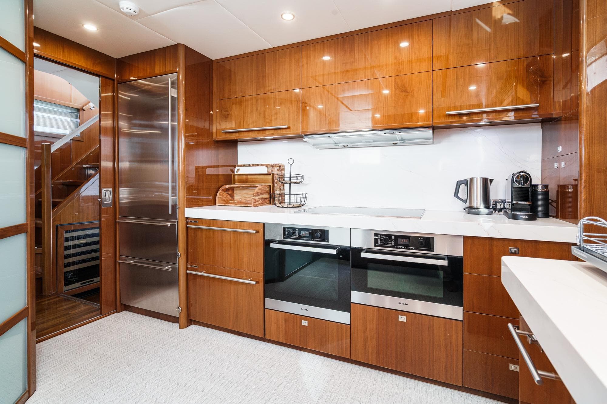 Luxurious kitchen interior on 2011 Princess 95 Motor Yacht with modern appliances.