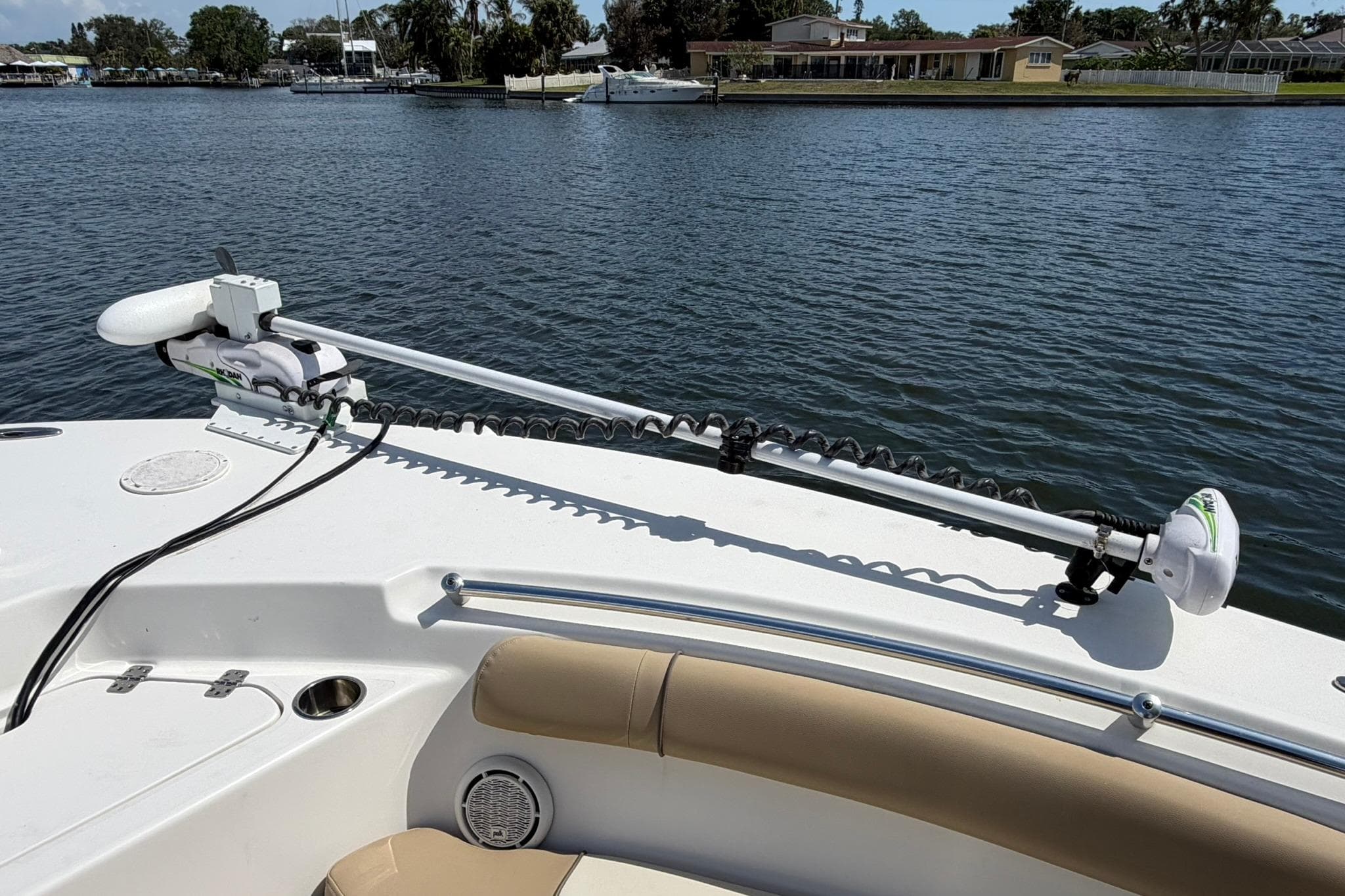 2019 Key West 244 Center Console boat with trolling motor on calm water.