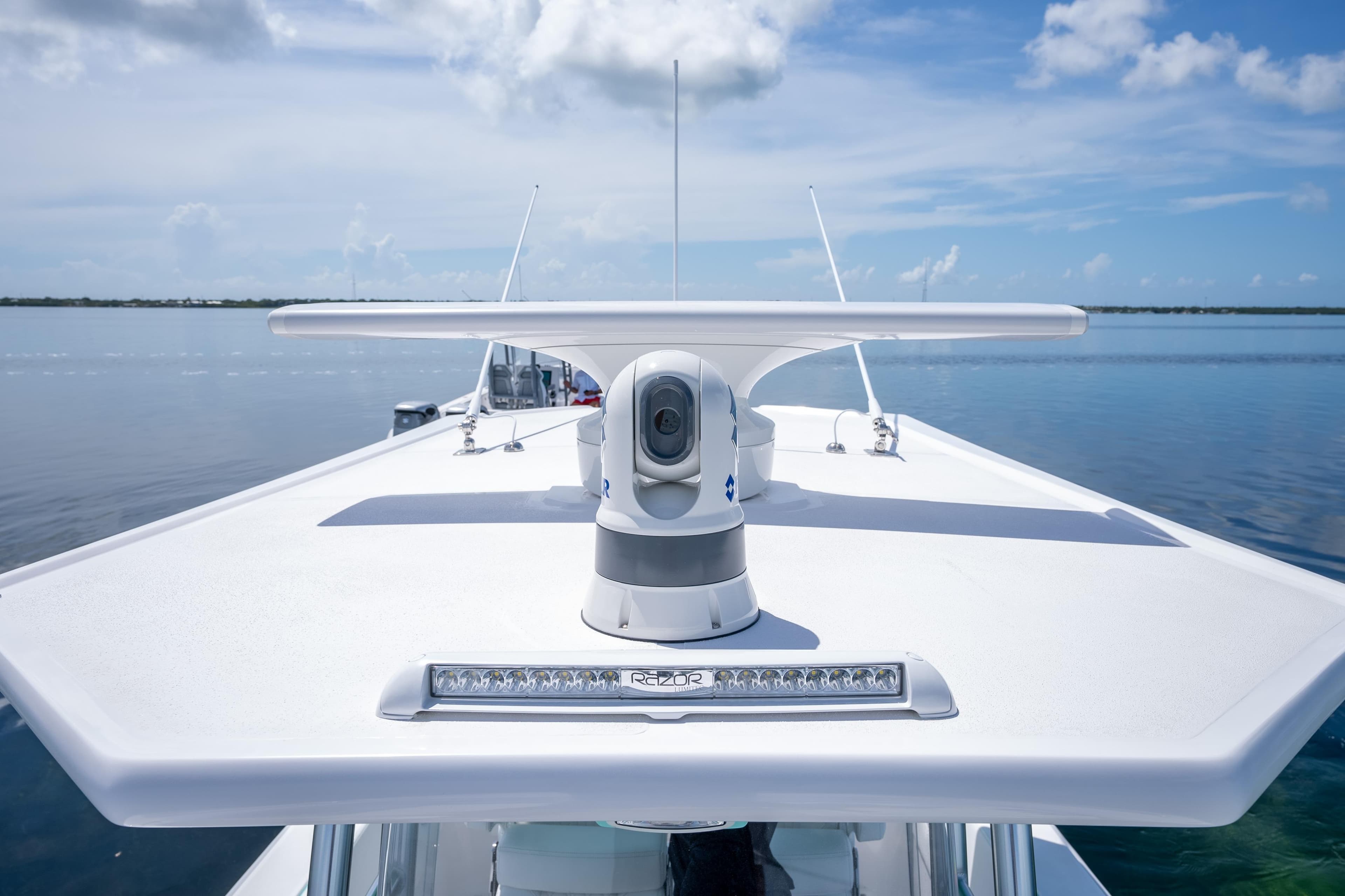 2024 Dynamic D-305V boat radar system on calm water under blue sky.