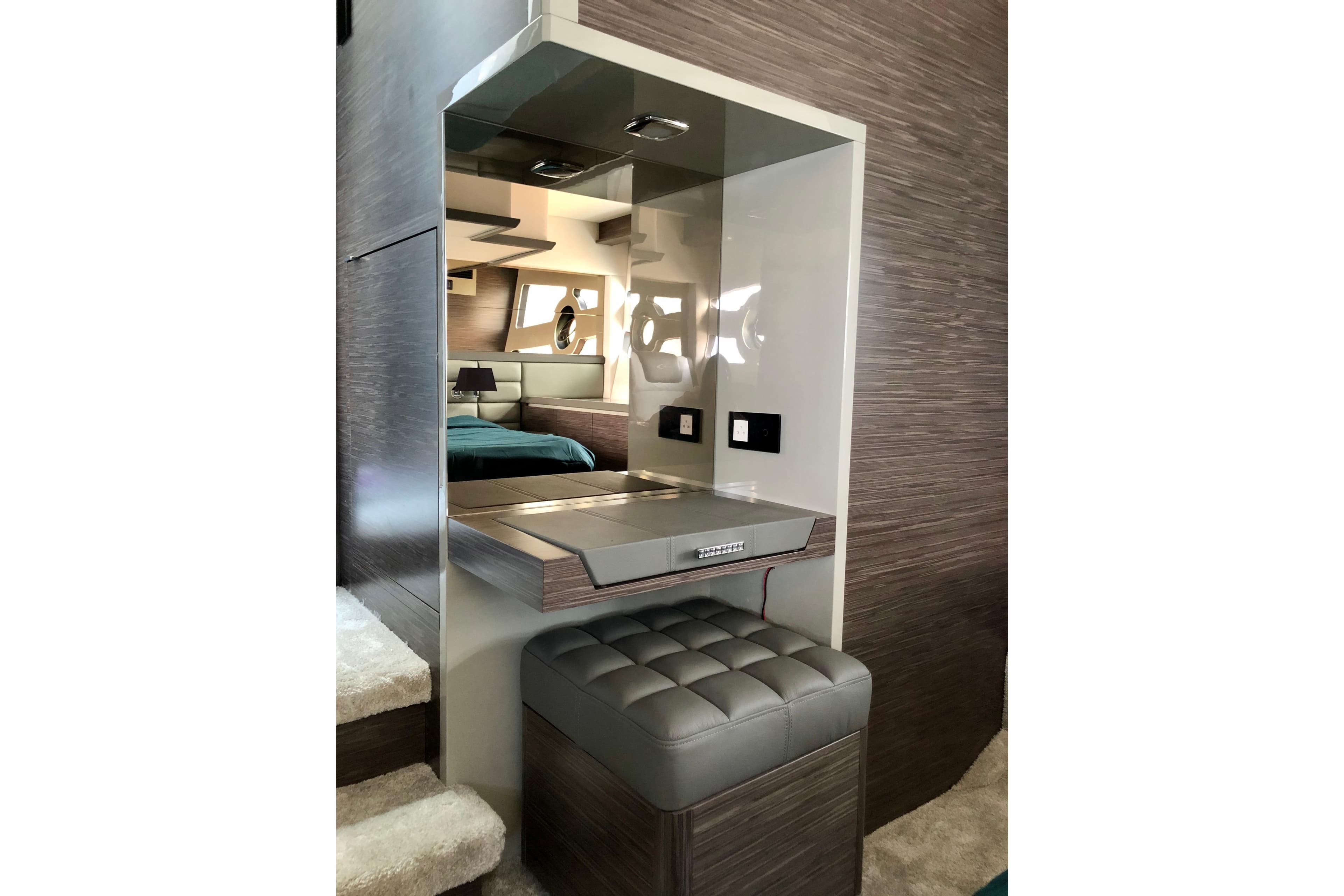 Luxurious interior of 2026 Cobrey 52 HT yacht with modern vanity and seating.