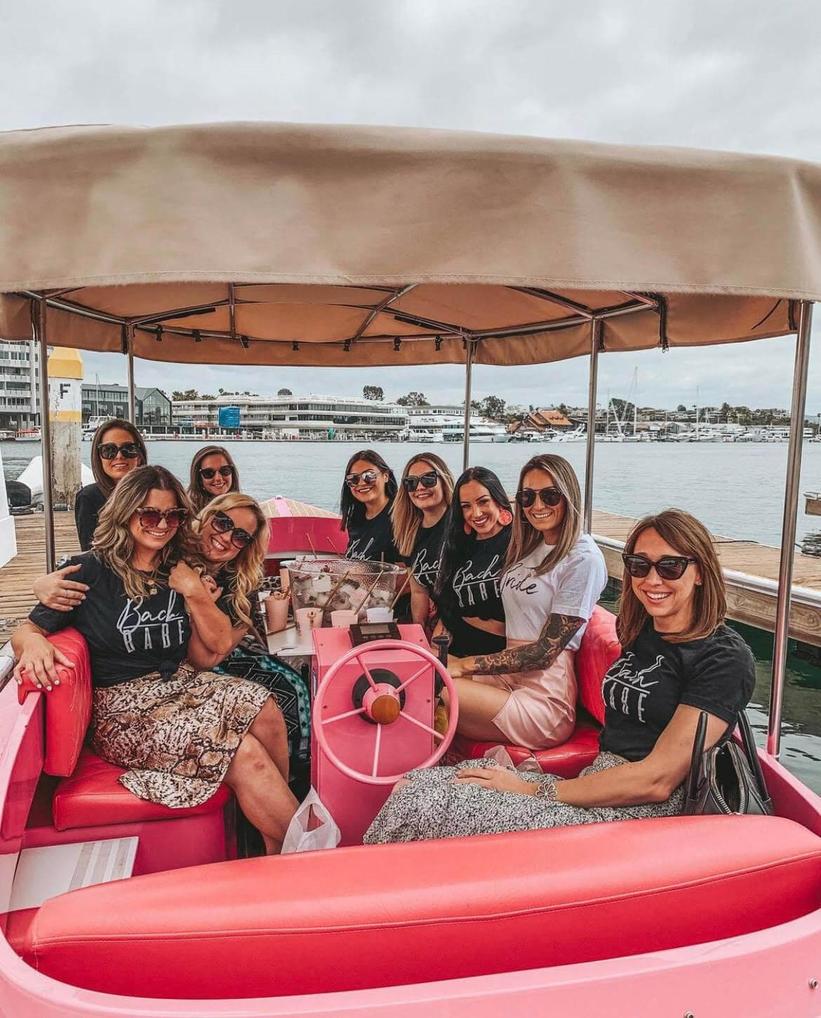 Group of women enjoying a ride on a 2023 Vision Marine Fantail 217 boat.