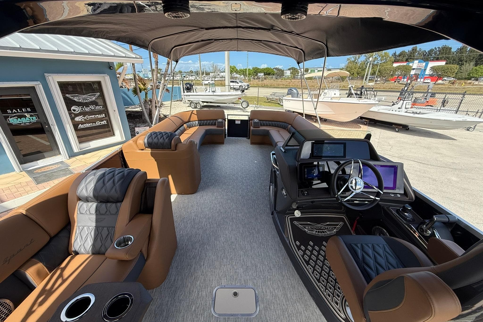 2026 Bennington QX 30 QXSBA X2 Wide Beam luxury boat interior with modern seating and controls.