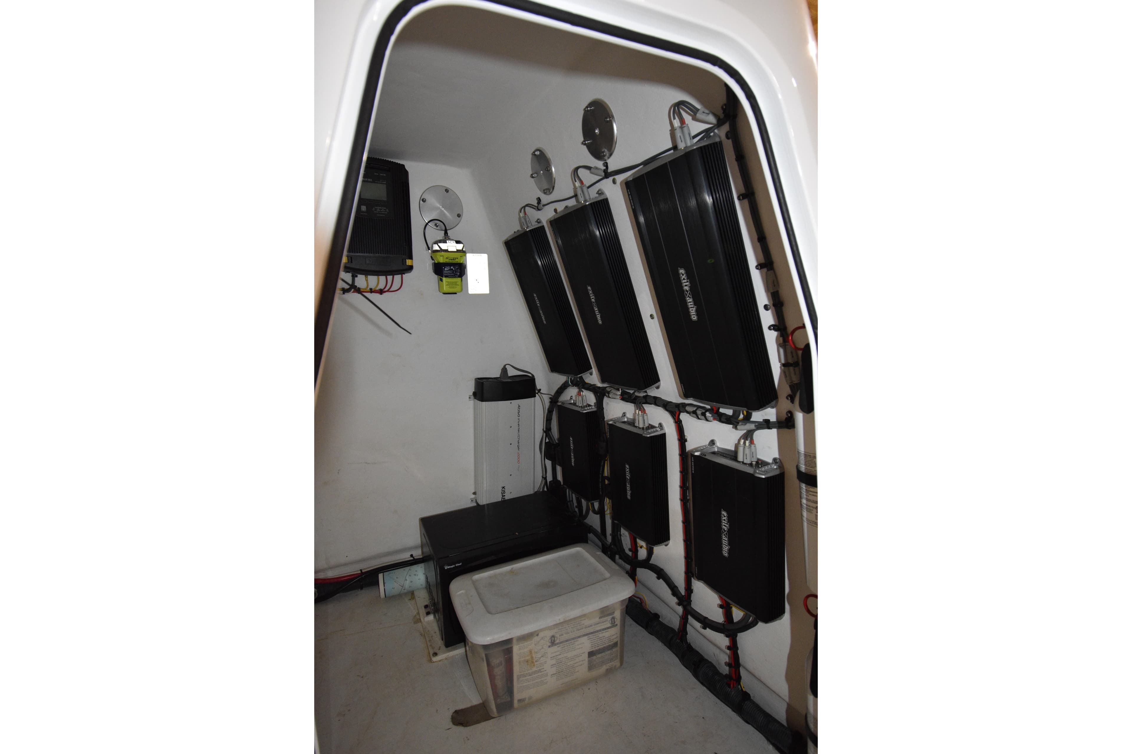 Electrical system setup inside a 2016 Freeman 37VH boat, featuring multiple components and wiring.