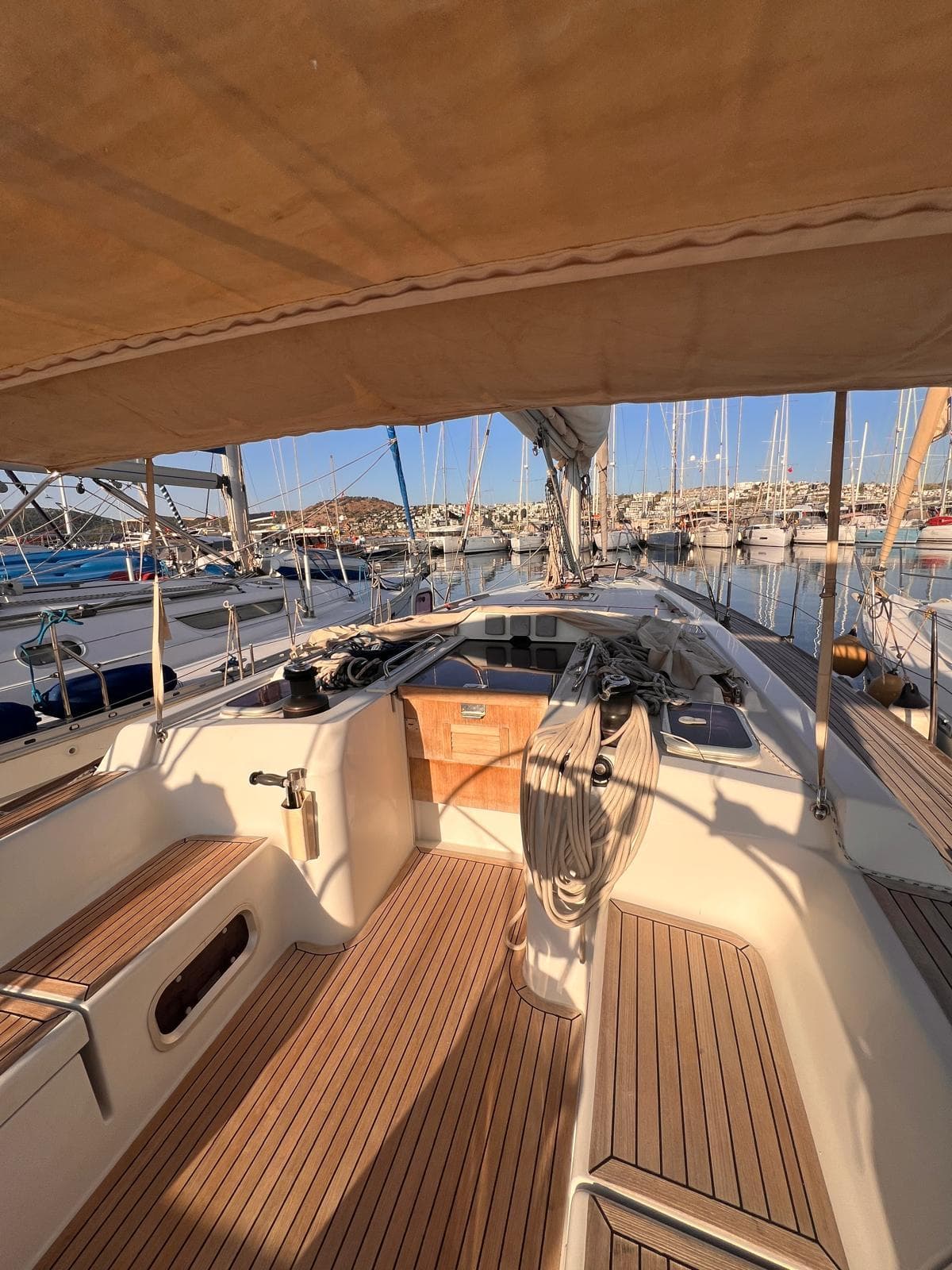 2007 Grand Soleil 43 sailboat cockpit with teak decking, docked in a marina.