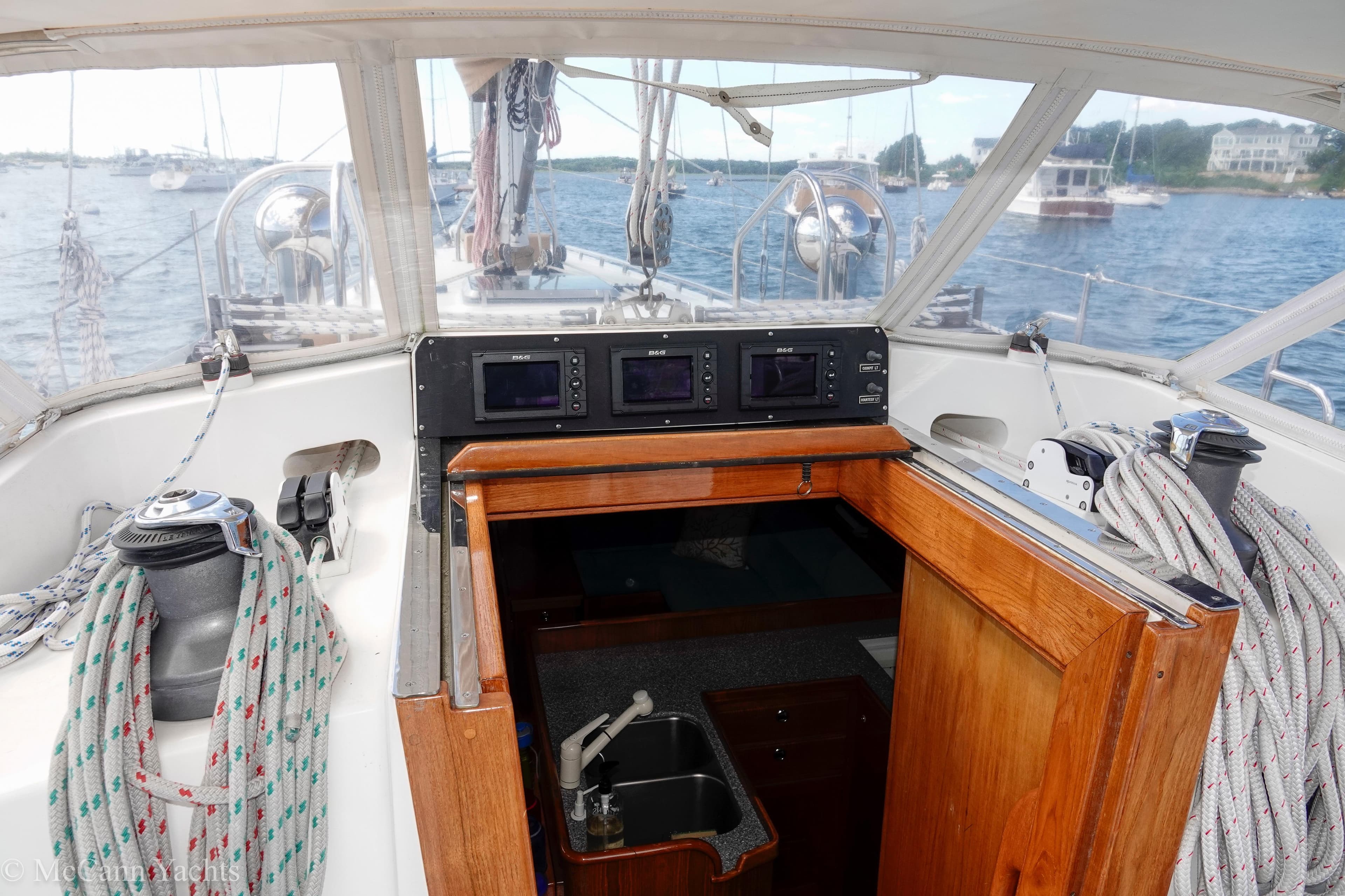 Alden 43 Aft Cockpit sailboat interior, showcasing navigation equipment and cabin entrance, 1993 model.