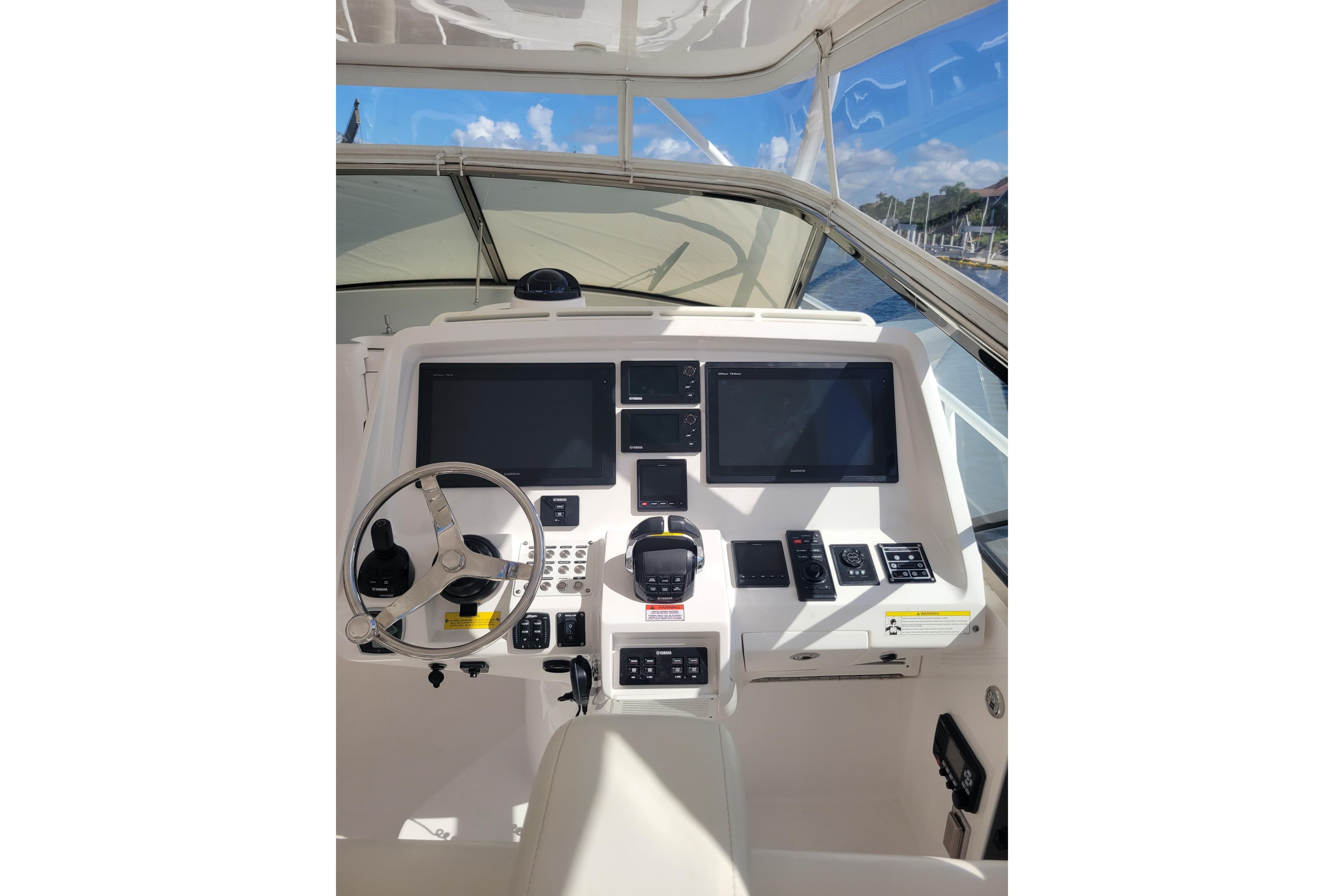 Helm of 2016 Intrepid 475 Sport Yacht with dual screens and controls.