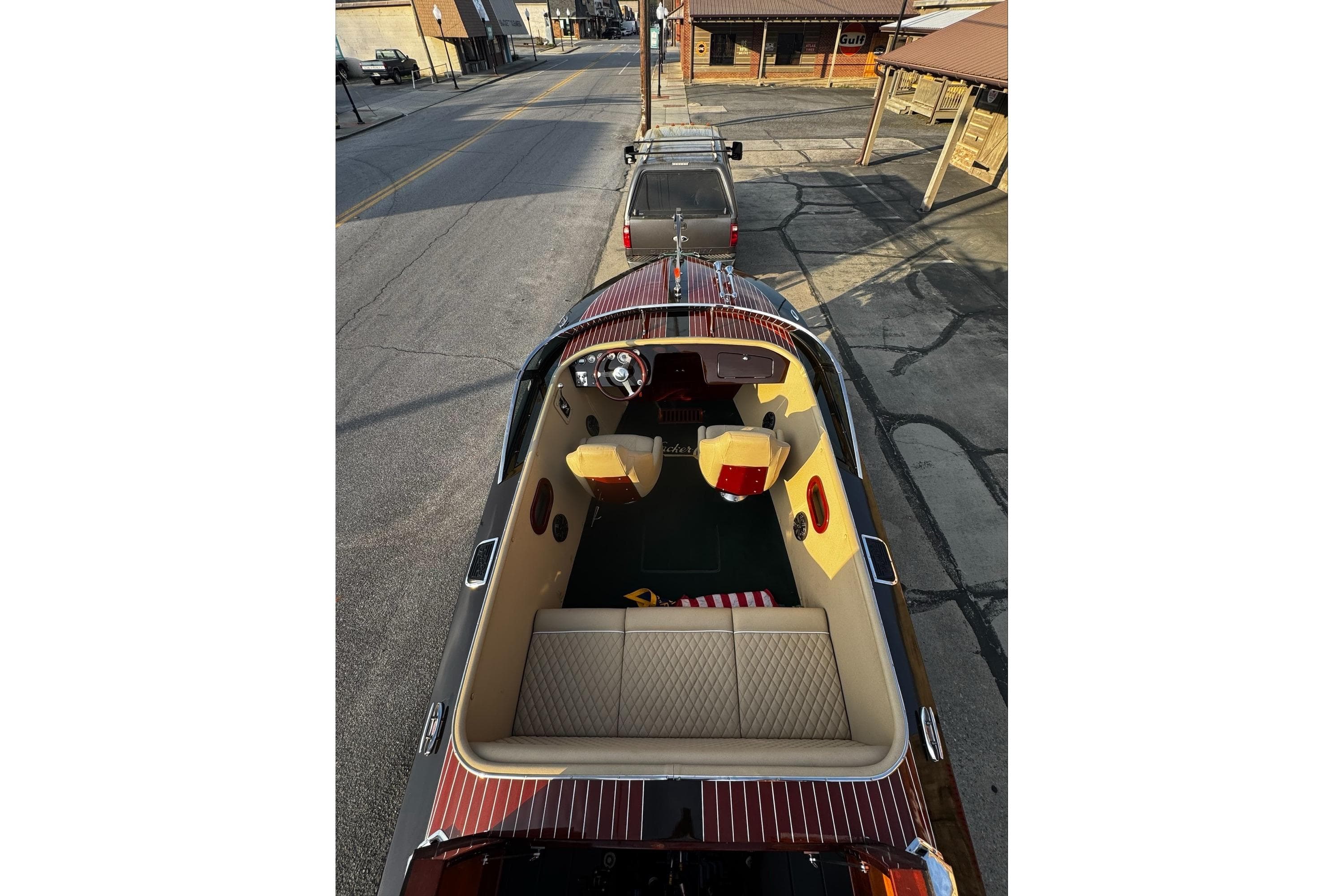 2019 Hacker-Craft 23 Runabout boat with luxurious interior parked on a street.