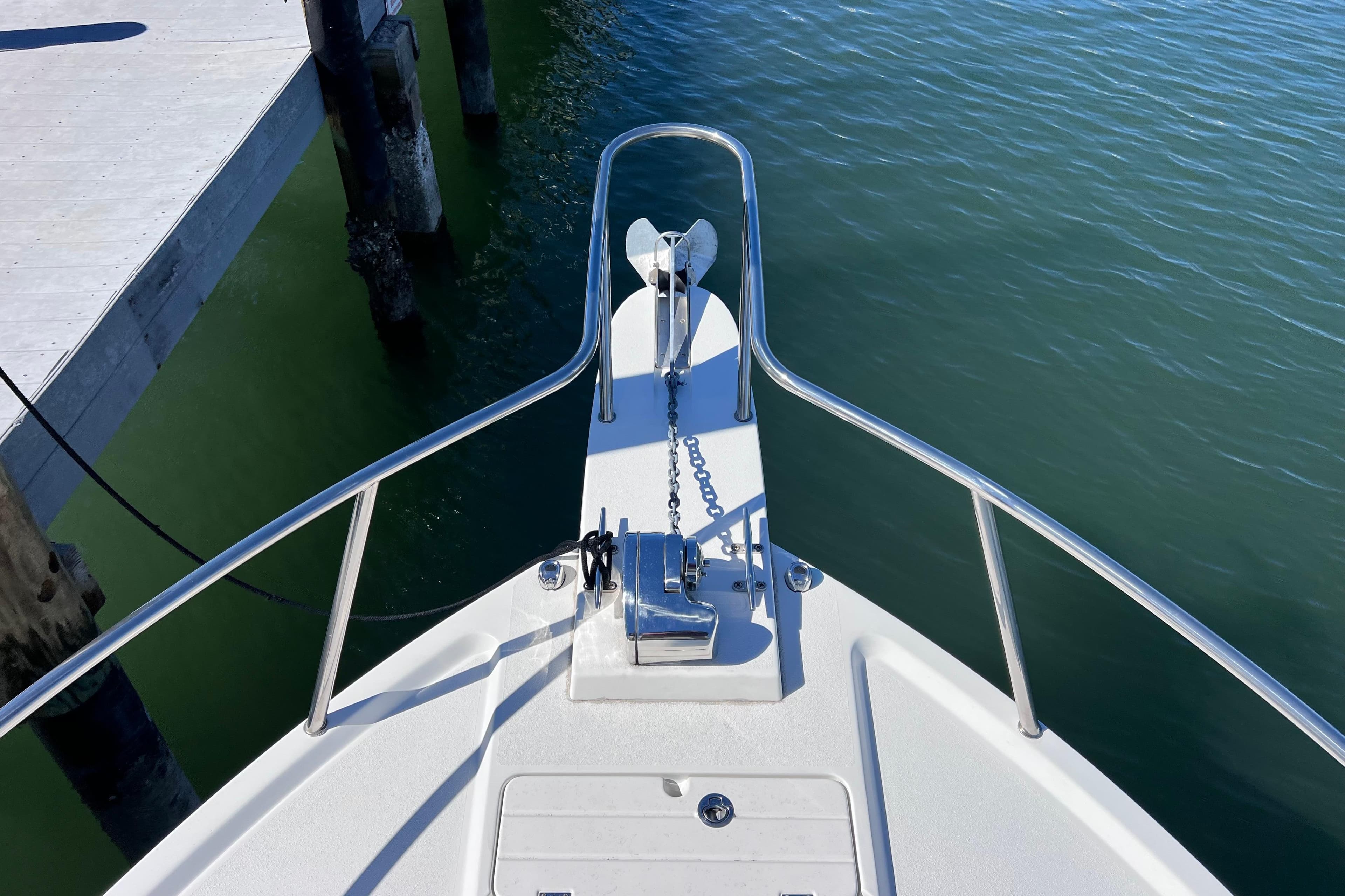 Bow view of 2023 Parker 2820 XLD Sport Cabin boat at dock.