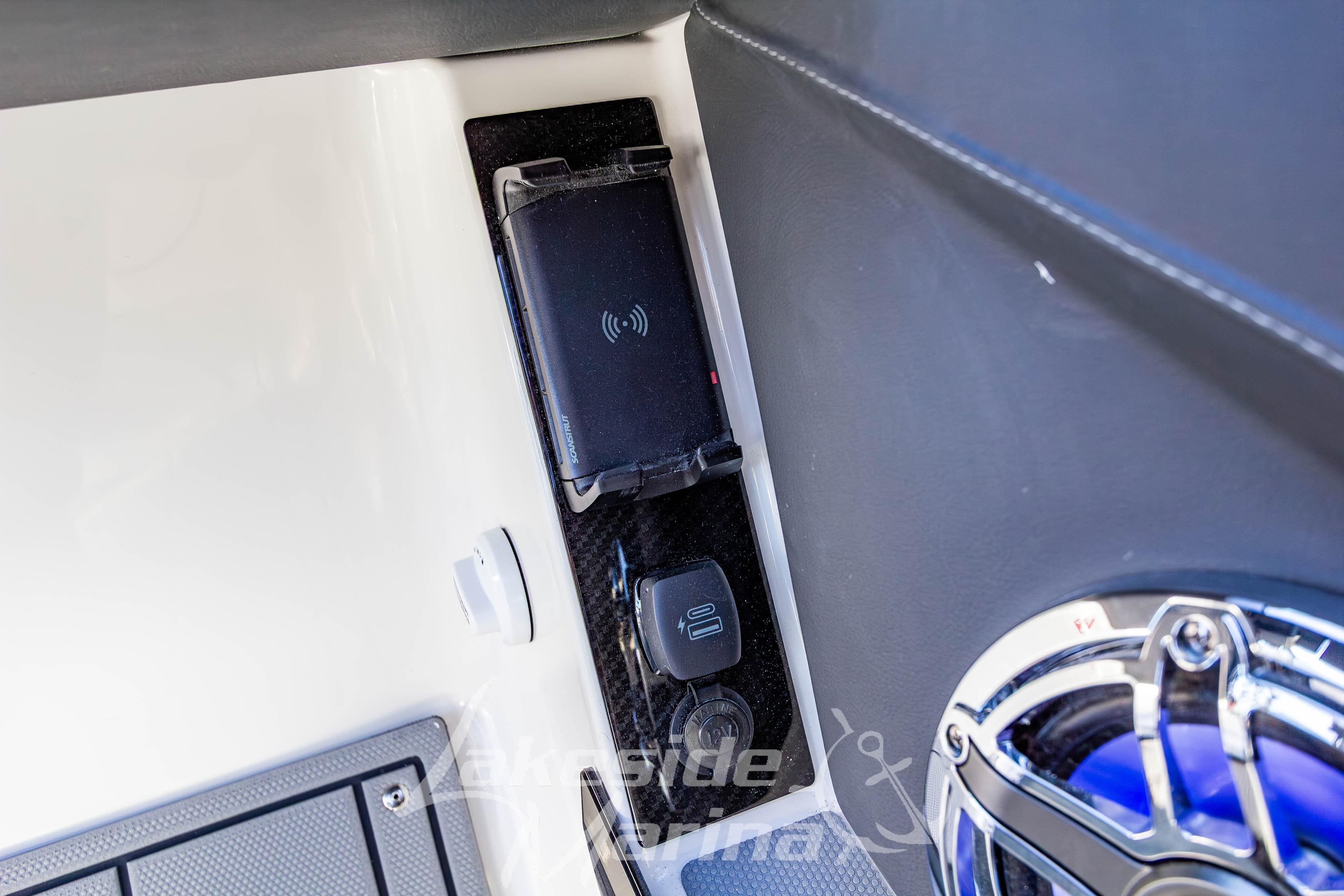 2026 Chaparral SSX 6 boat interior with wireless charging pad and speaker.