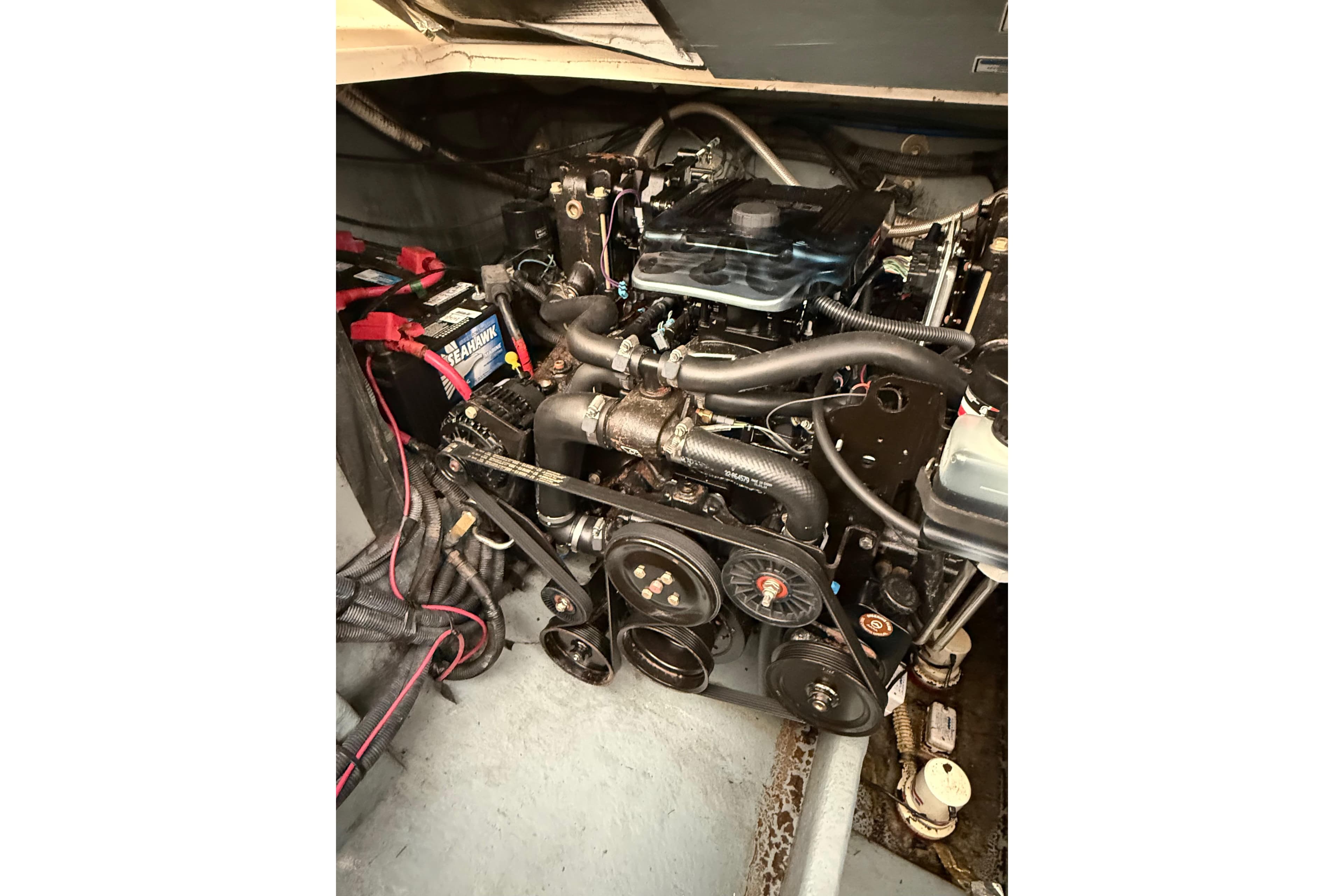Engine compartment of a 2001 Sea Ray Sundancer 310 boat, showcasing mechanical components.