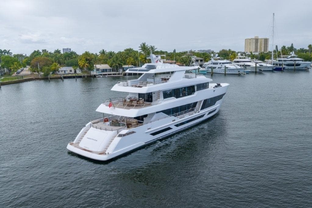 Luxurious 2026 Hargrave E Series yacht cruising in a scenic marina setting.
