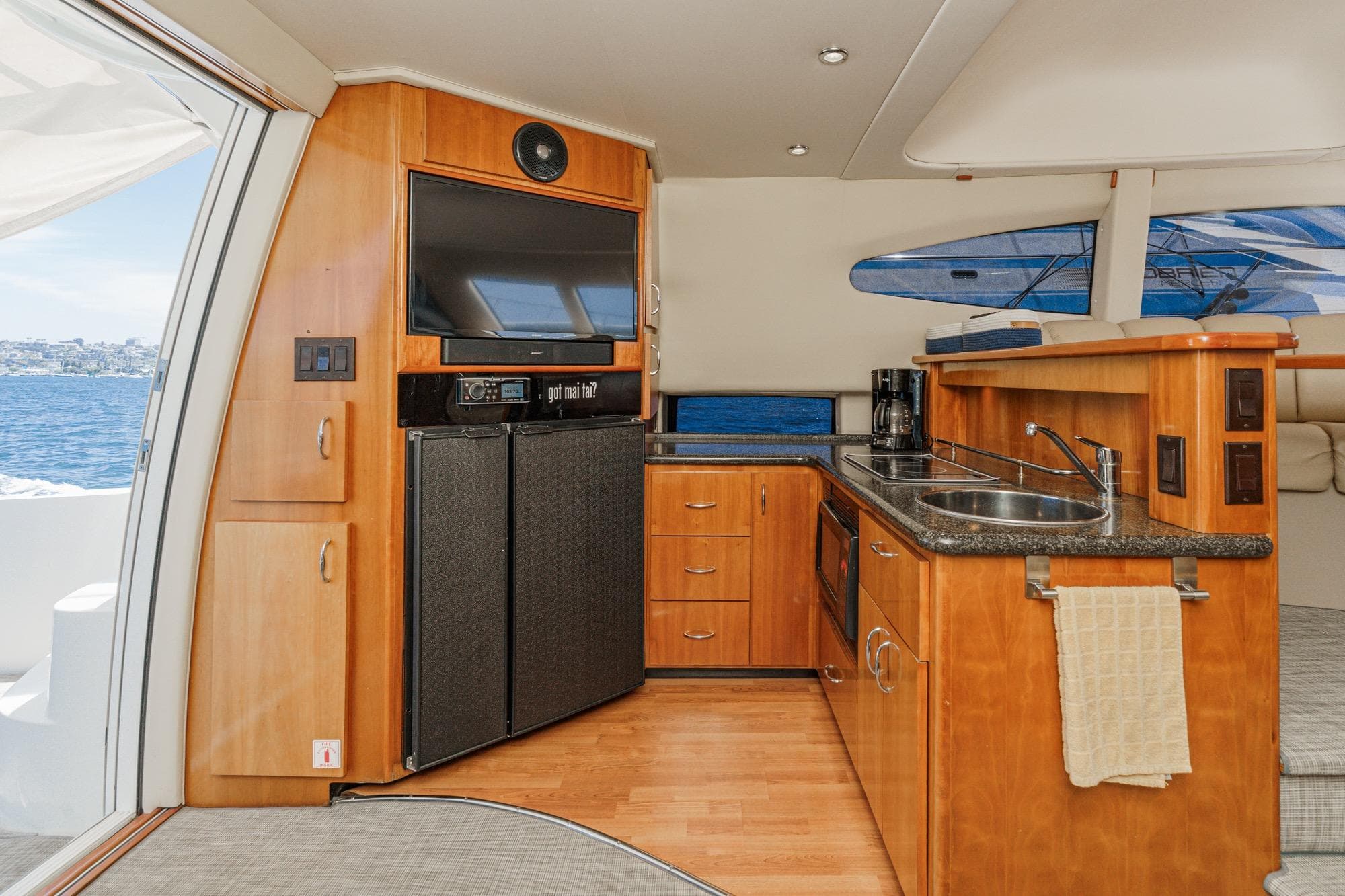 Interior of 2005 Carver 38 Super Sport yacht with kitchen and entertainment area.